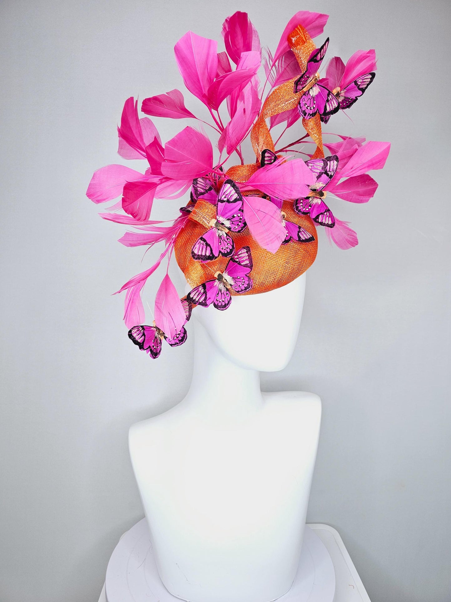 kentucky derby hat fascinator tangerine orange sinamay with sinamay curls and hot pink branching feathers with pink and black butterflies