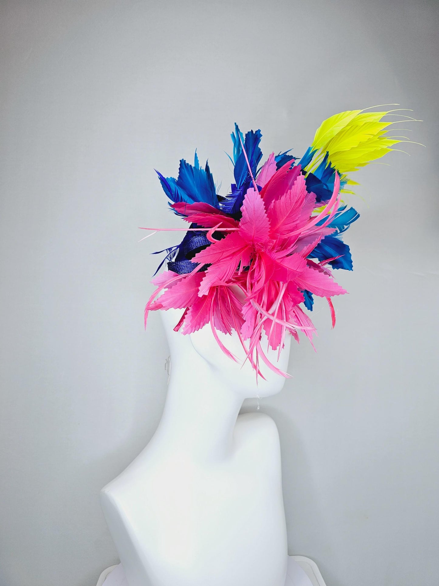 kentucky derby hat fascinator pink fluffy feather flower,royal blue branching zigzag feathers and bright yellow pointy feathers