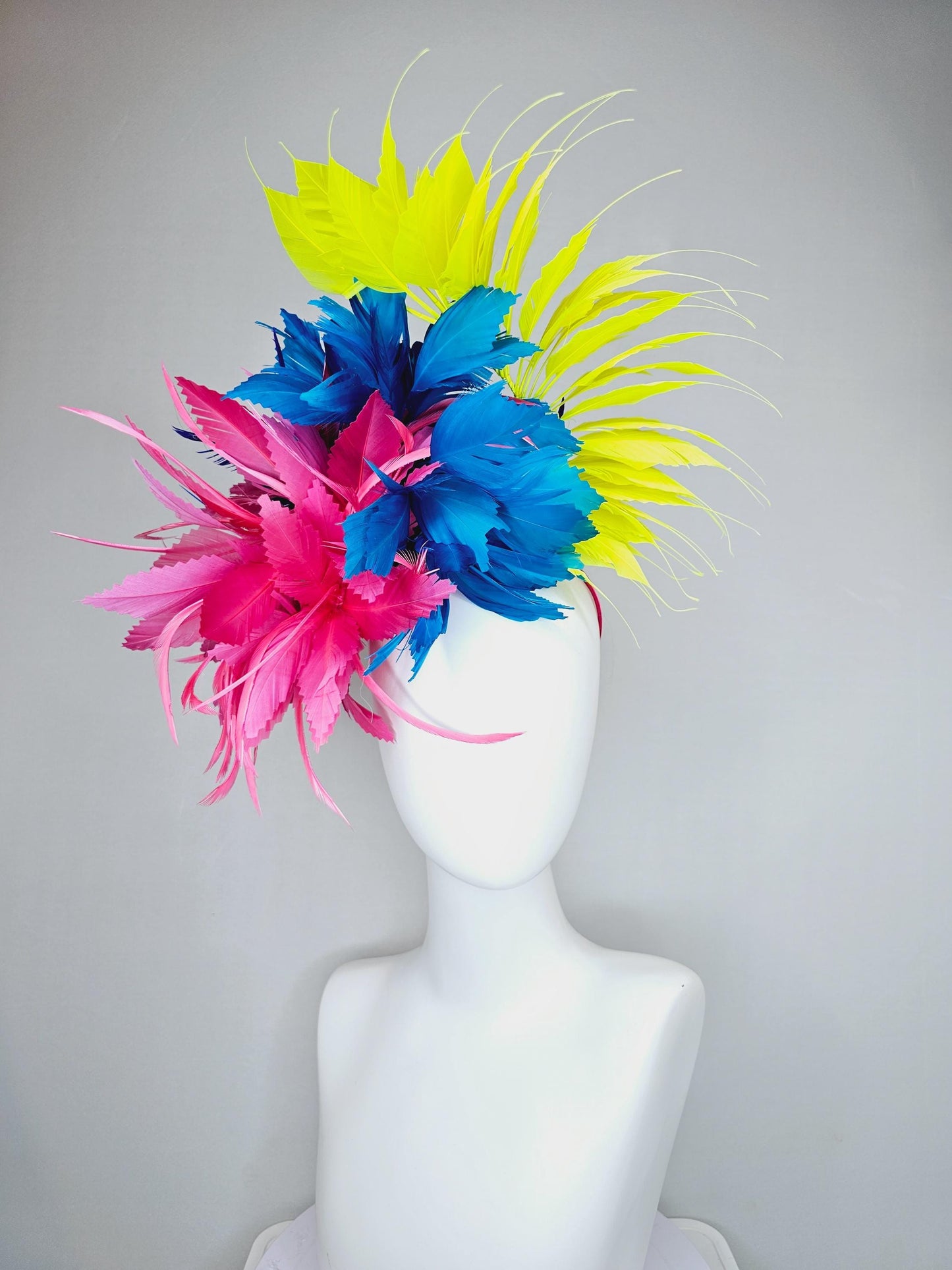 kentucky derby hat fascinator pink fluffy feather flower,royal blue branching zigzag feathers and bright yellow pointy feathers