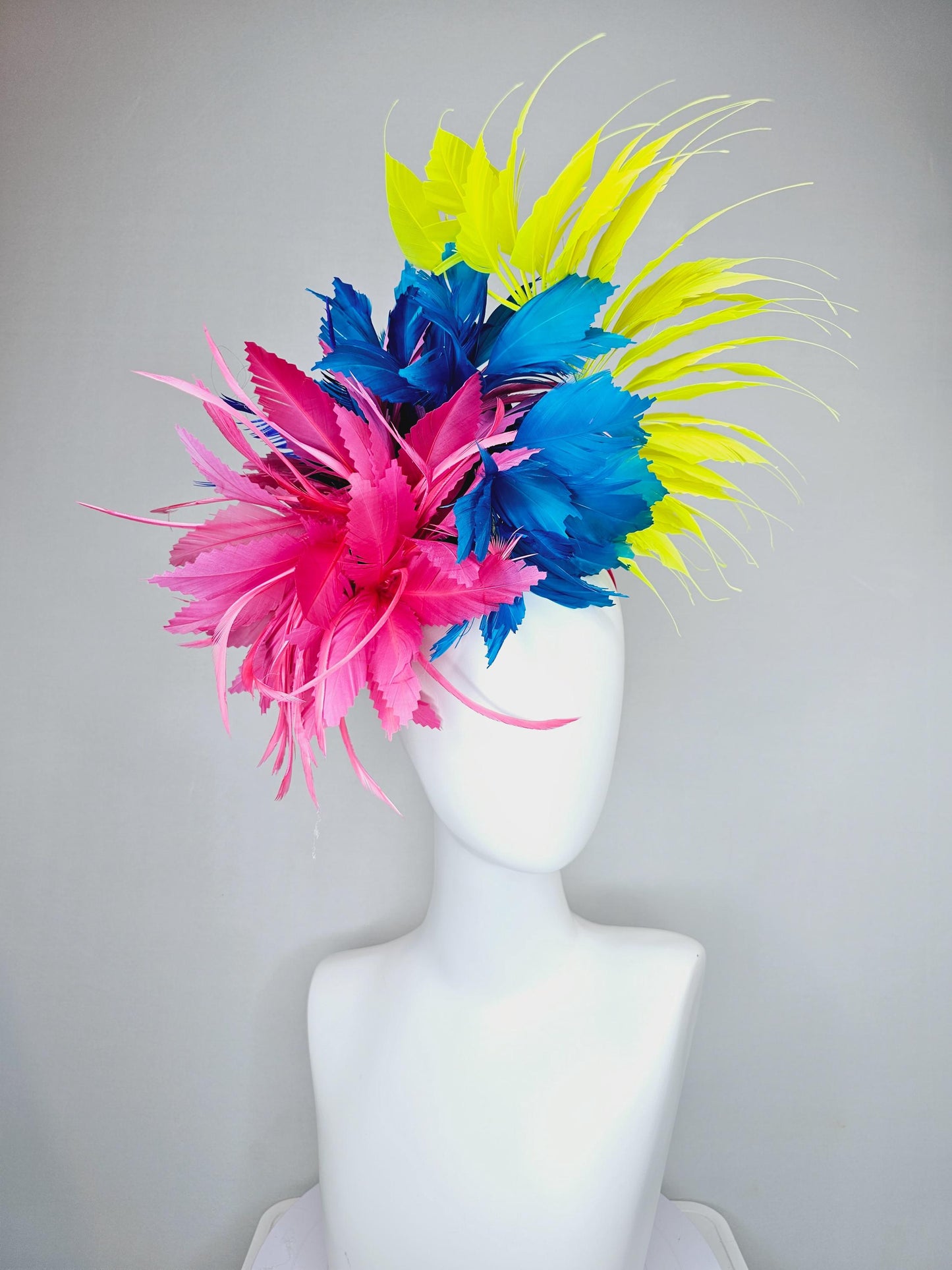 kentucky derby hat fascinator pink fluffy feather flower,royal blue branching zigzag feathers and bright yellow pointy feathers