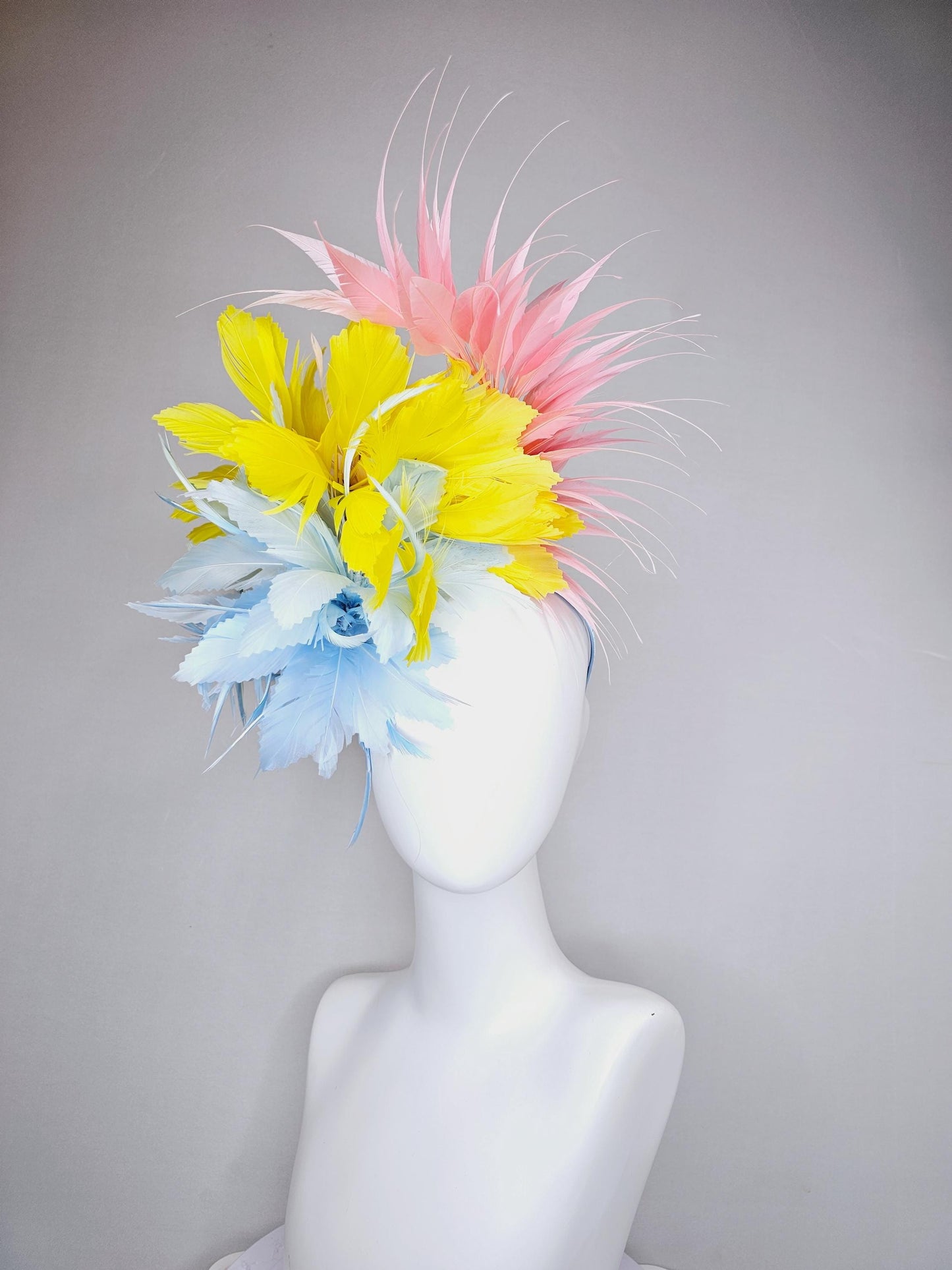 kentucky derby hat fascinator light blue fluffy feather flower with bright yellow branching feathers and light pink pointy feathers