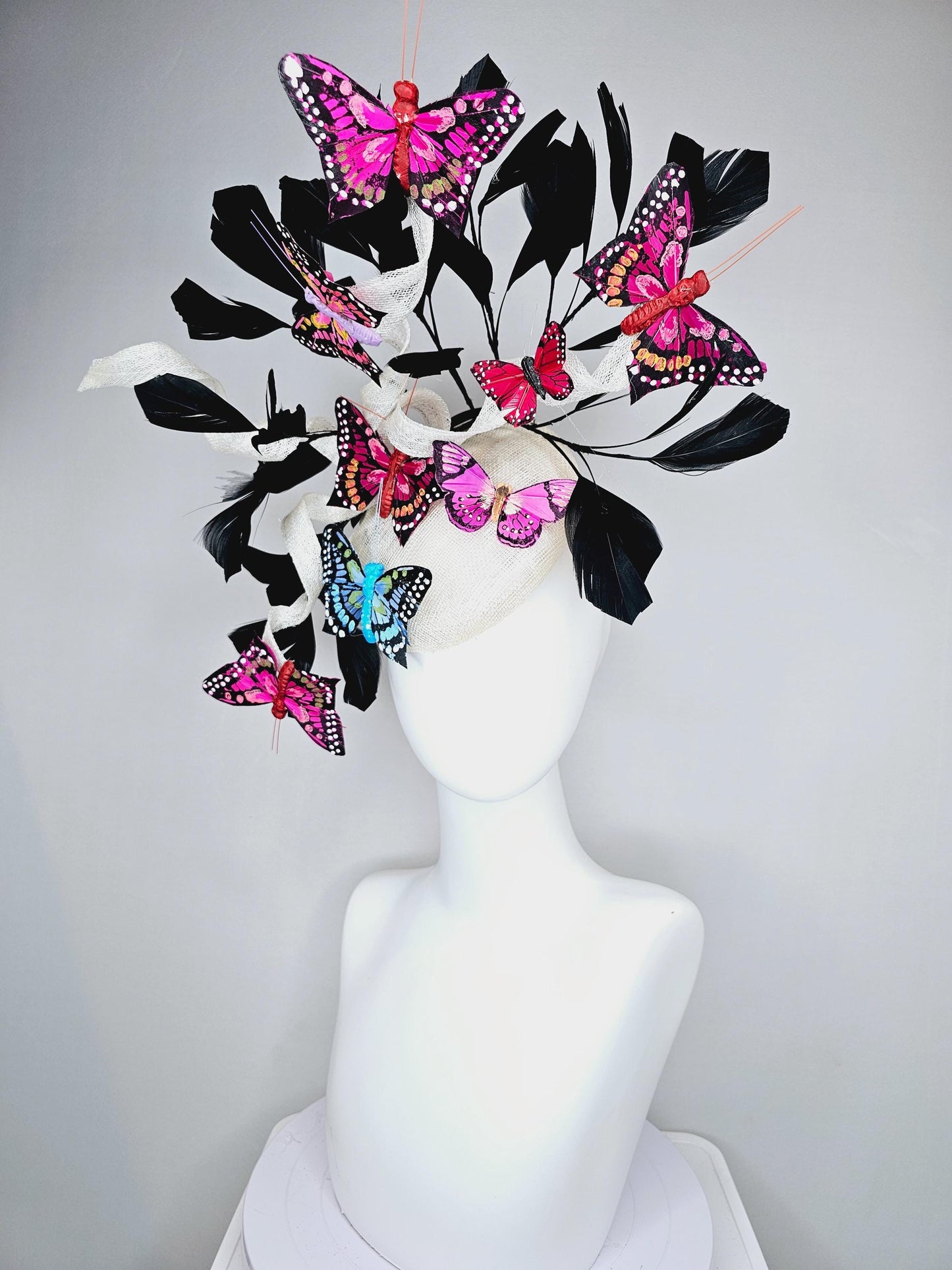 kentucky derby hat fascinator white sinamay with curls,black branching feathers,colorful rainbow pink,blue,purple,red painted butterflies