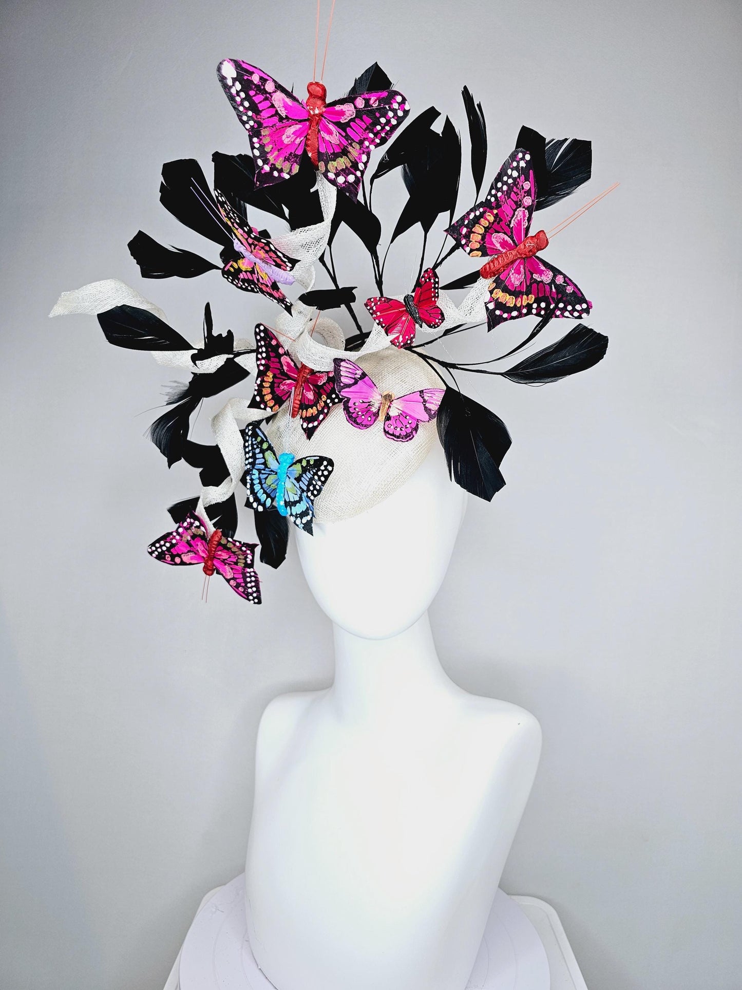 kentucky derby hat fascinator white sinamay with curls,black branching feathers,colorful rainbow pink,blue,purple,red painted butterflies