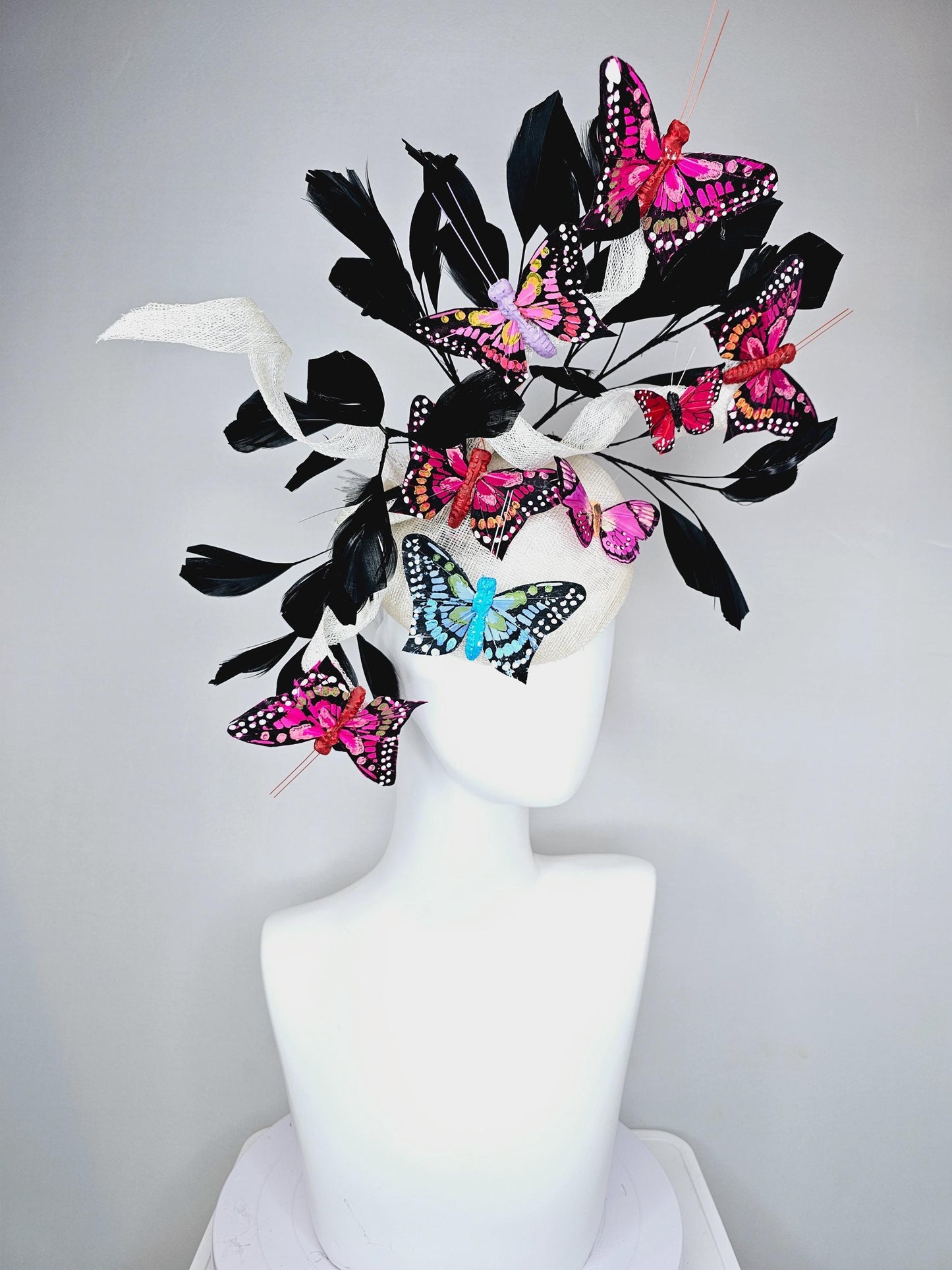kentucky derby hat fascinator white sinamay with curls,black branching feathers,colorful rainbow pink,blue,purple,red painted butterflies