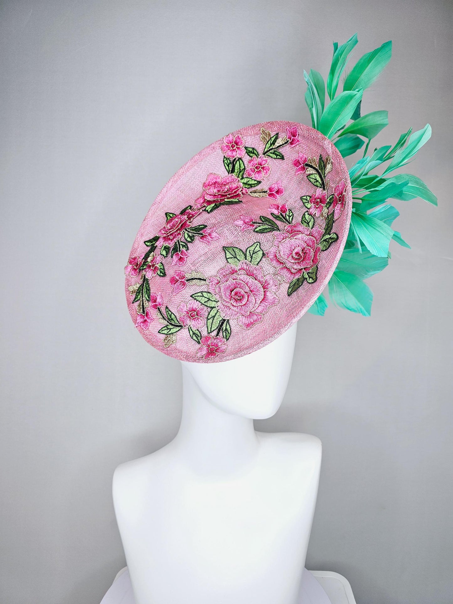 kentucky derby hat fascinator light pink sinamay saucer with pink flowers green leaves embroidered and aqua mint green branching feathers