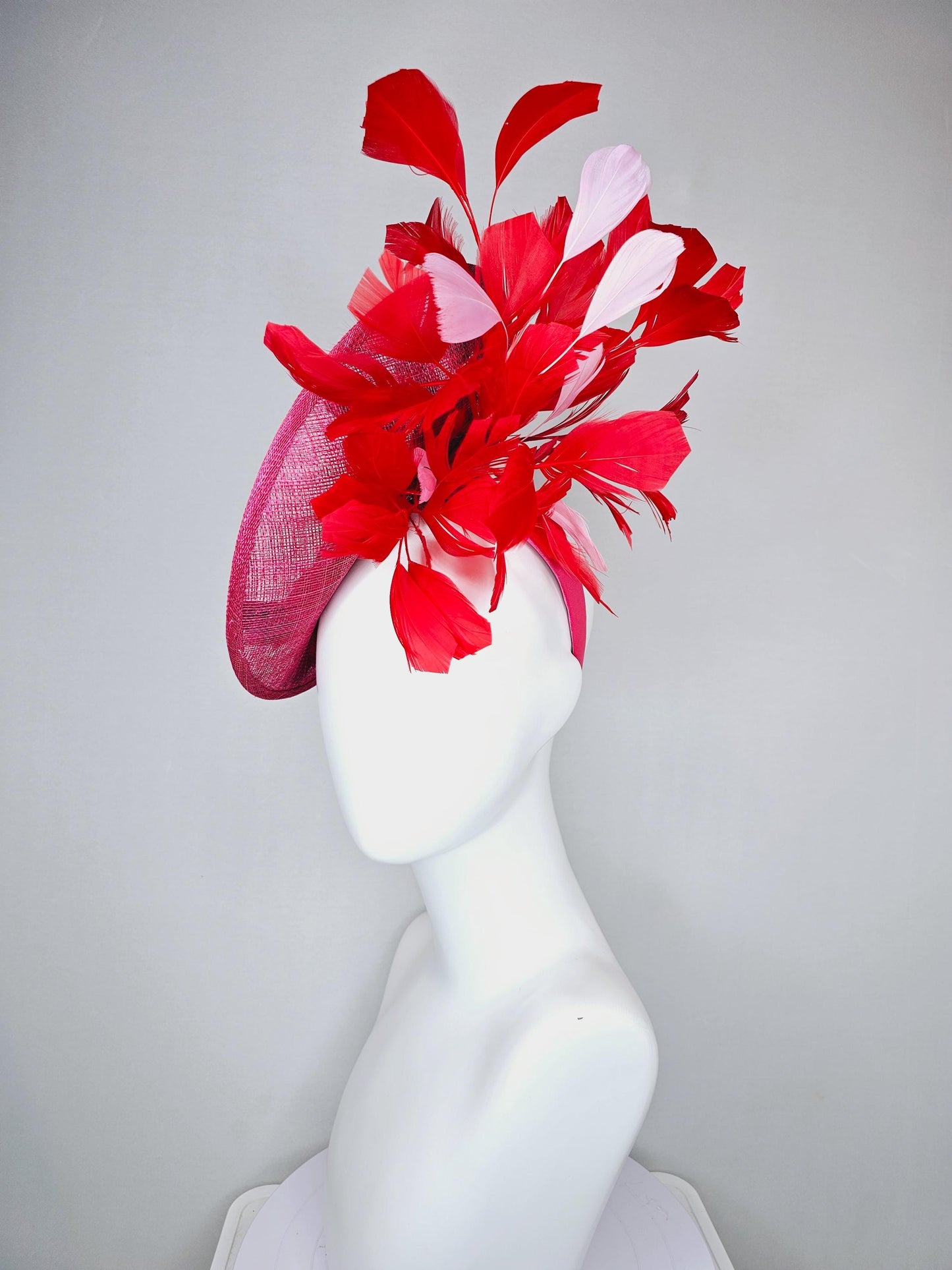 kentucky derby hat fascinator raspberry pink sinamay saucer with red pink blue green floral embroidered, scarlet red and light pink feathers
