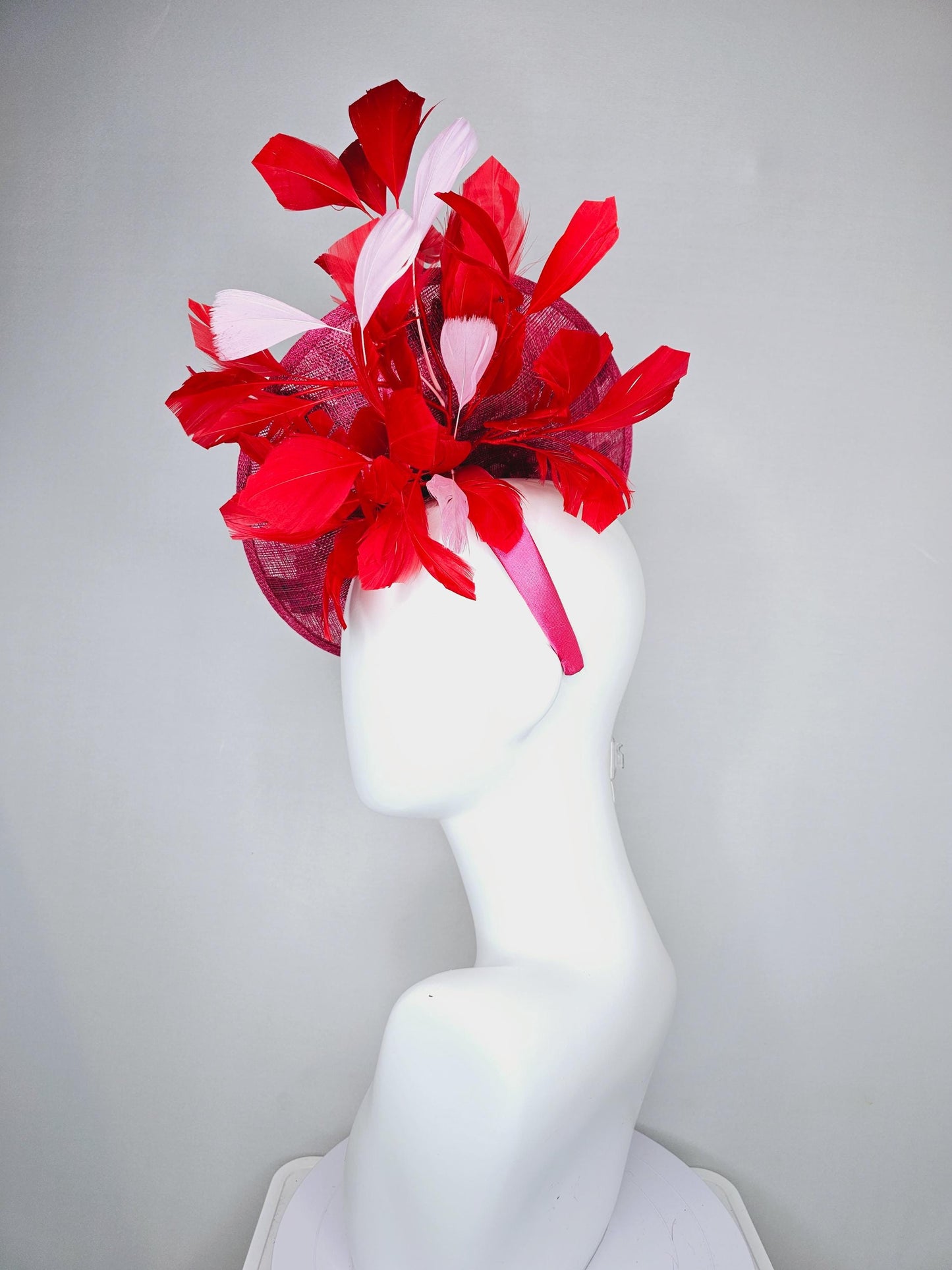 kentucky derby hat fascinator raspberry pink sinamay saucer with red pink blue green floral embroidered, scarlet red and light pink feathers