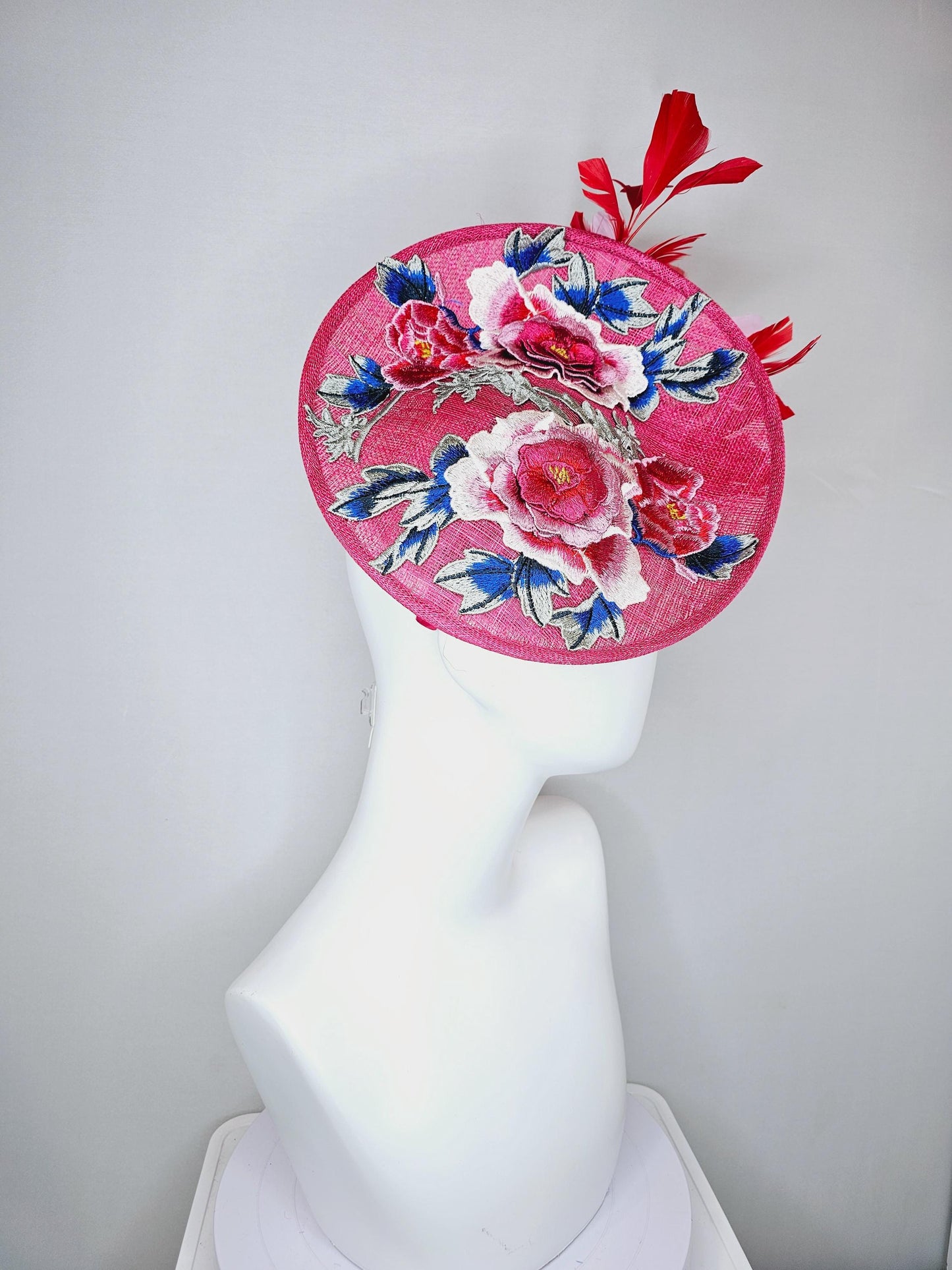 kentucky derby hat fascinator raspberry pink sinamay saucer with red pink blue green floral embroidered, scarlet red and light pink feathers