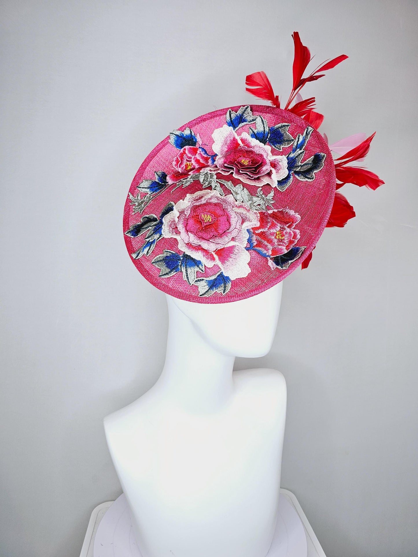 kentucky derby hat fascinator raspberry pink sinamay saucer with red pink blue green floral embroidered, scarlet red and light pink feathers