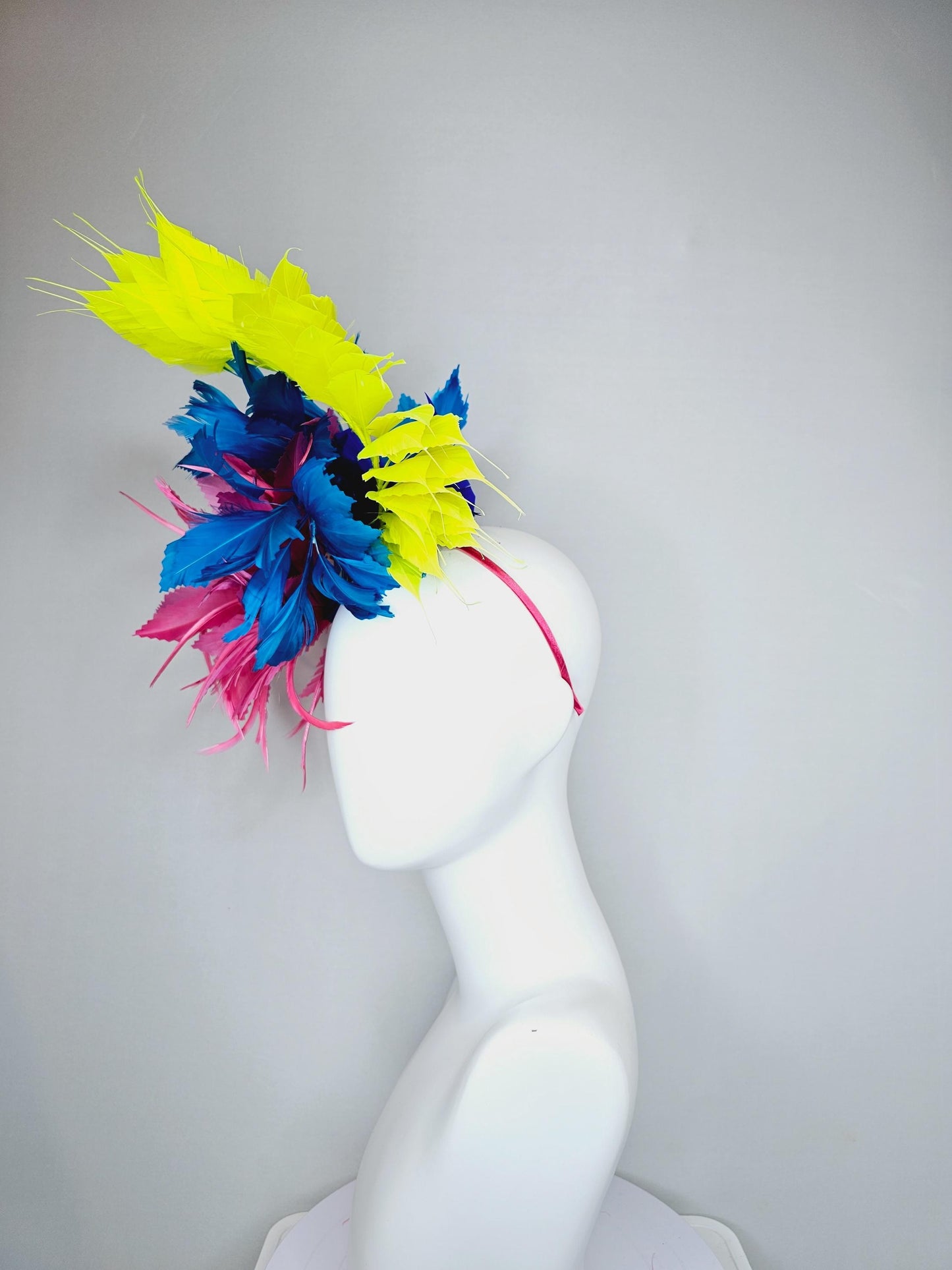 kentucky derby hat fascinator pink fluffy feather flower,royal blue branching zigzag feathers and bright yellow pointy feathers