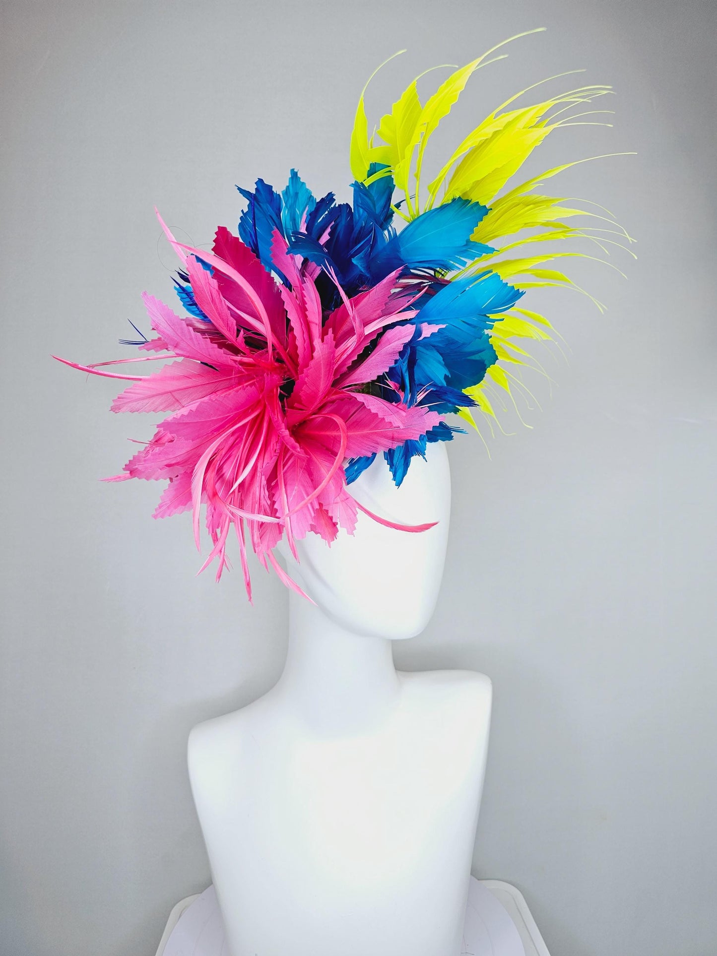 kentucky derby hat fascinator pink fluffy feather flower,royal blue branching zigzag feathers and bright yellow pointy feathers