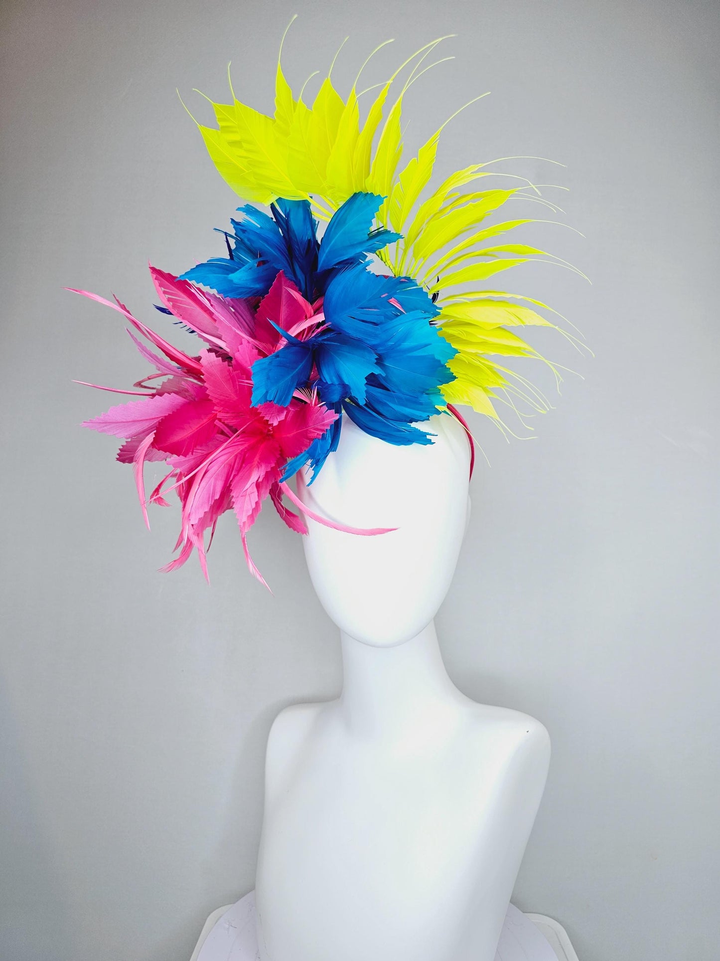 kentucky derby hat fascinator pink fluffy feather flower,royal blue branching zigzag feathers and bright yellow pointy feathers