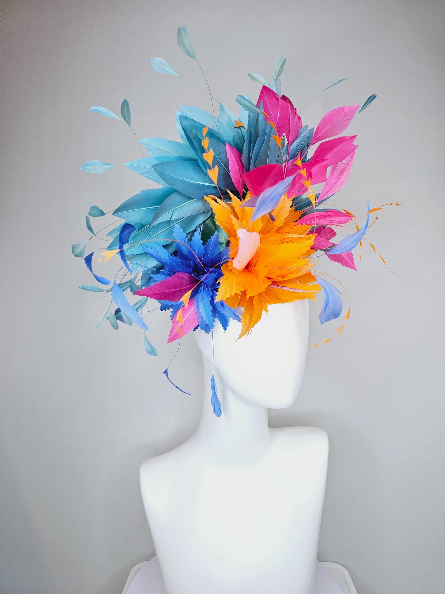 kentucky derby hat fascinator tangerine orange feather flower with colorful pink,blue teal,and cobalt blue branching feathers