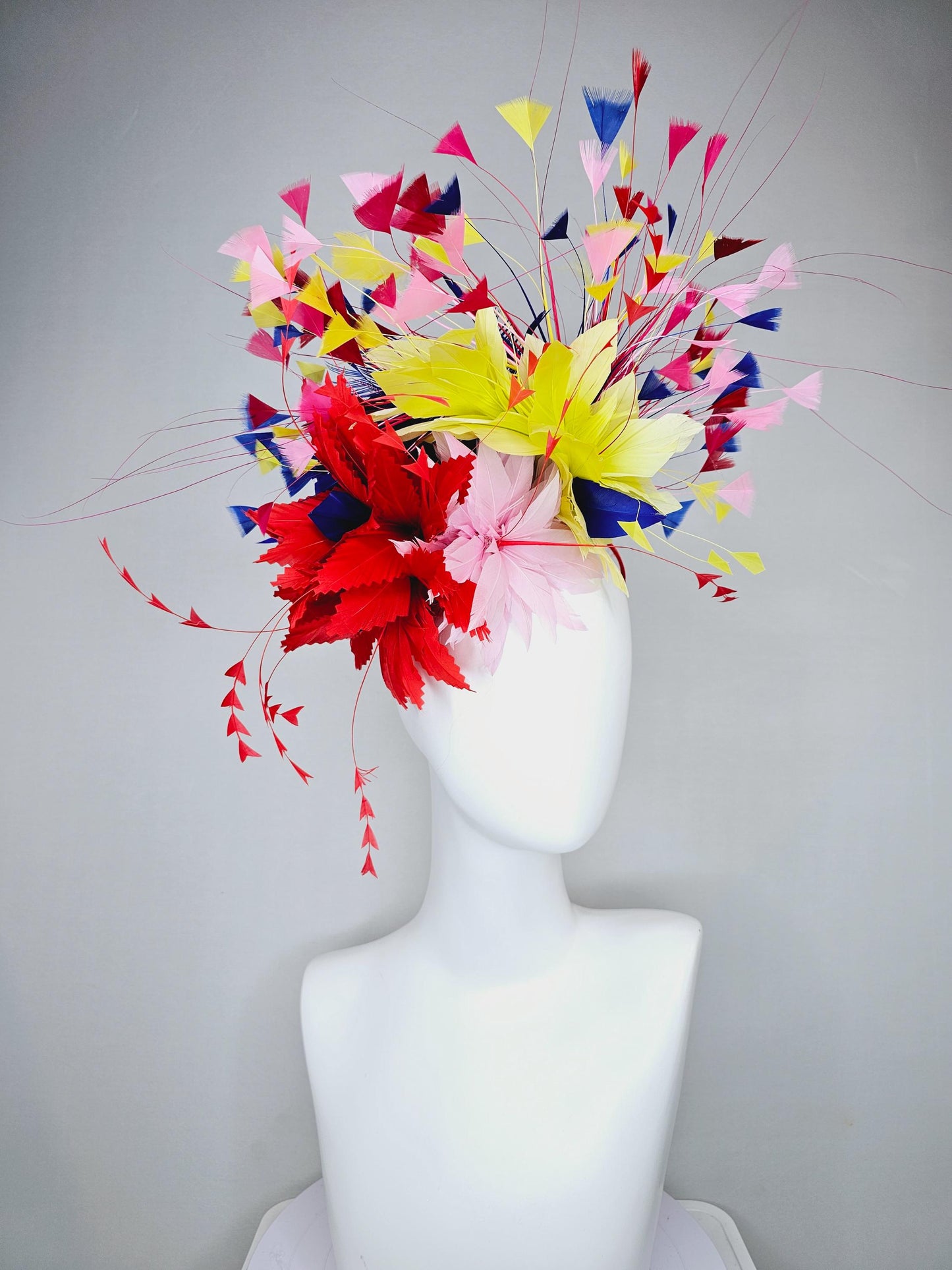 kentucky derby hat fascinator light pink and red zigzag feather flowers with colorful light pink, yellow, cobalt blue,red branching feathers