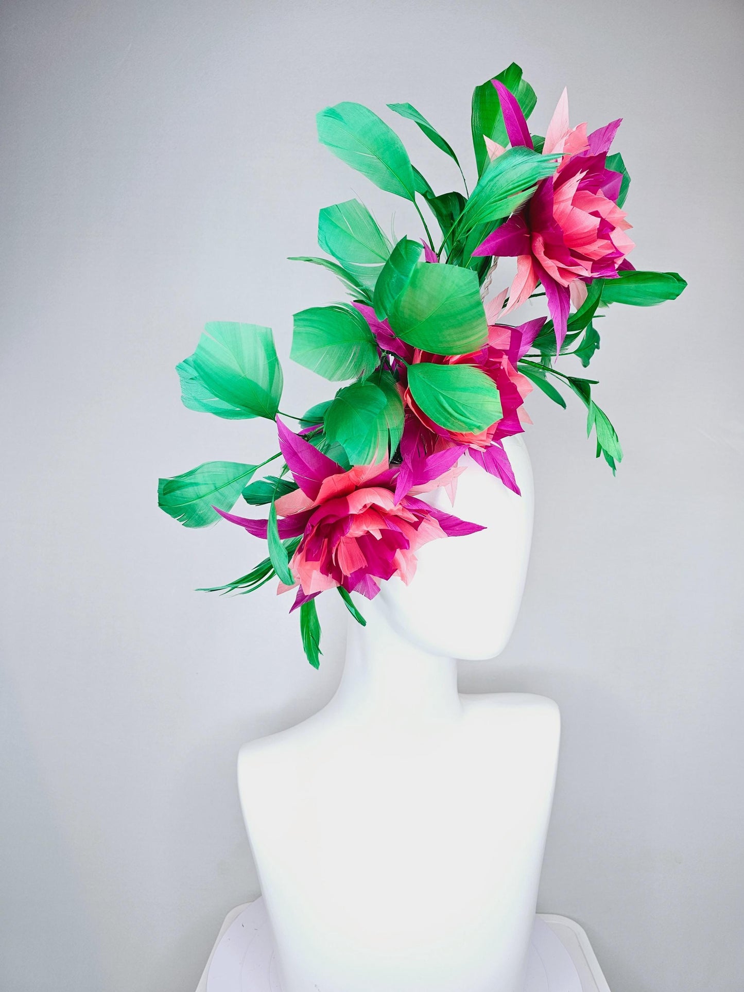 kentucky derby hat fascinator with large burgundy red raspberry red fuchsia pink feather flowers and emerald green branching feathers