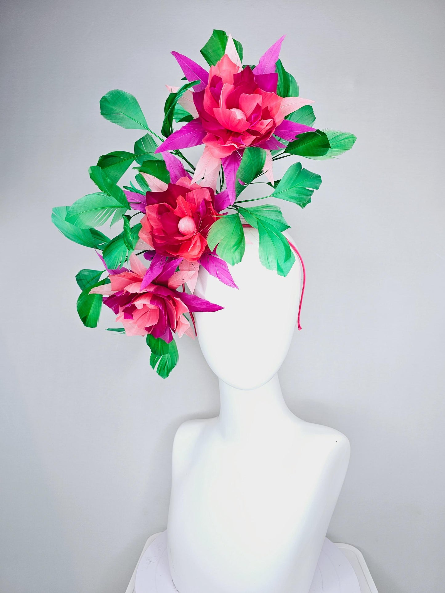 kentucky derby hat fascinator with large burgundy red raspberry red fuchsia pink feather flowers and emerald green branching feathers