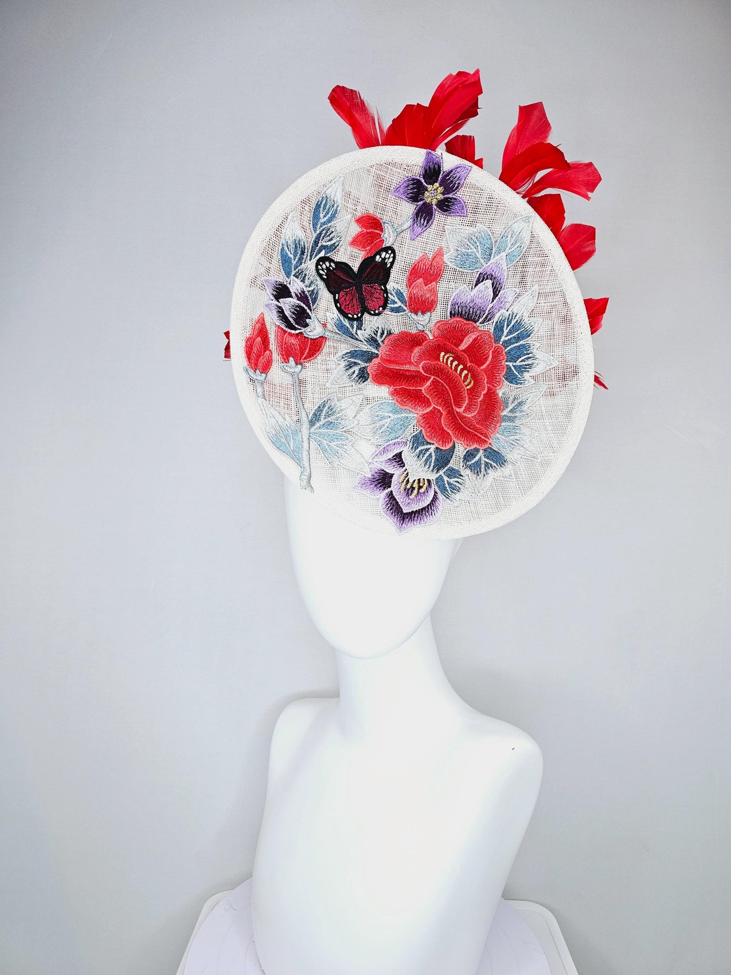 kentucky derby hat fascinator white sinamay saucer with red blue purple black embroidered flowers butterfly, scarlet red branching feathers