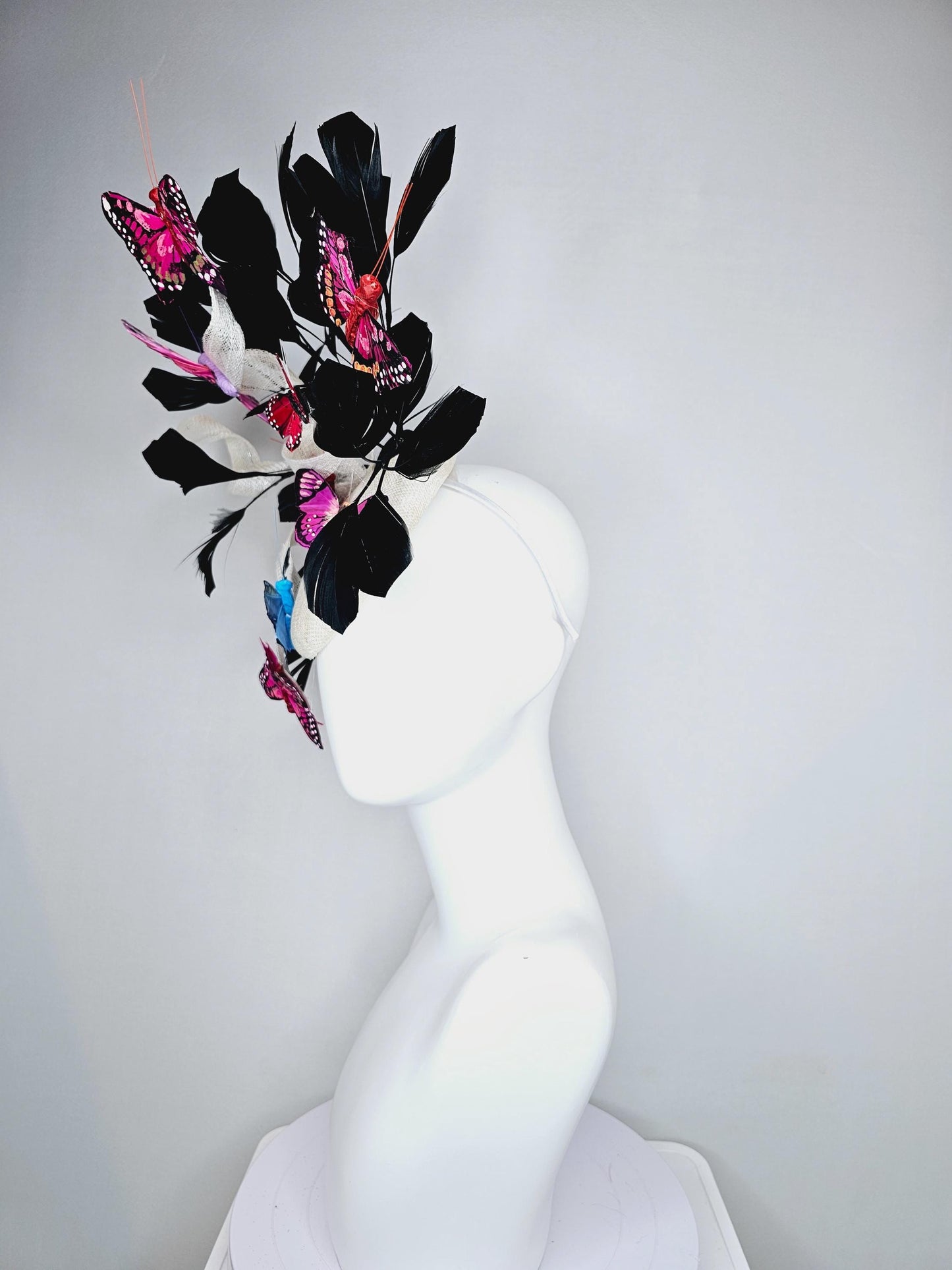kentucky derby hat fascinator white sinamay with curls,black branching feathers,colorful rainbow pink,blue,purple,red painted butterflies