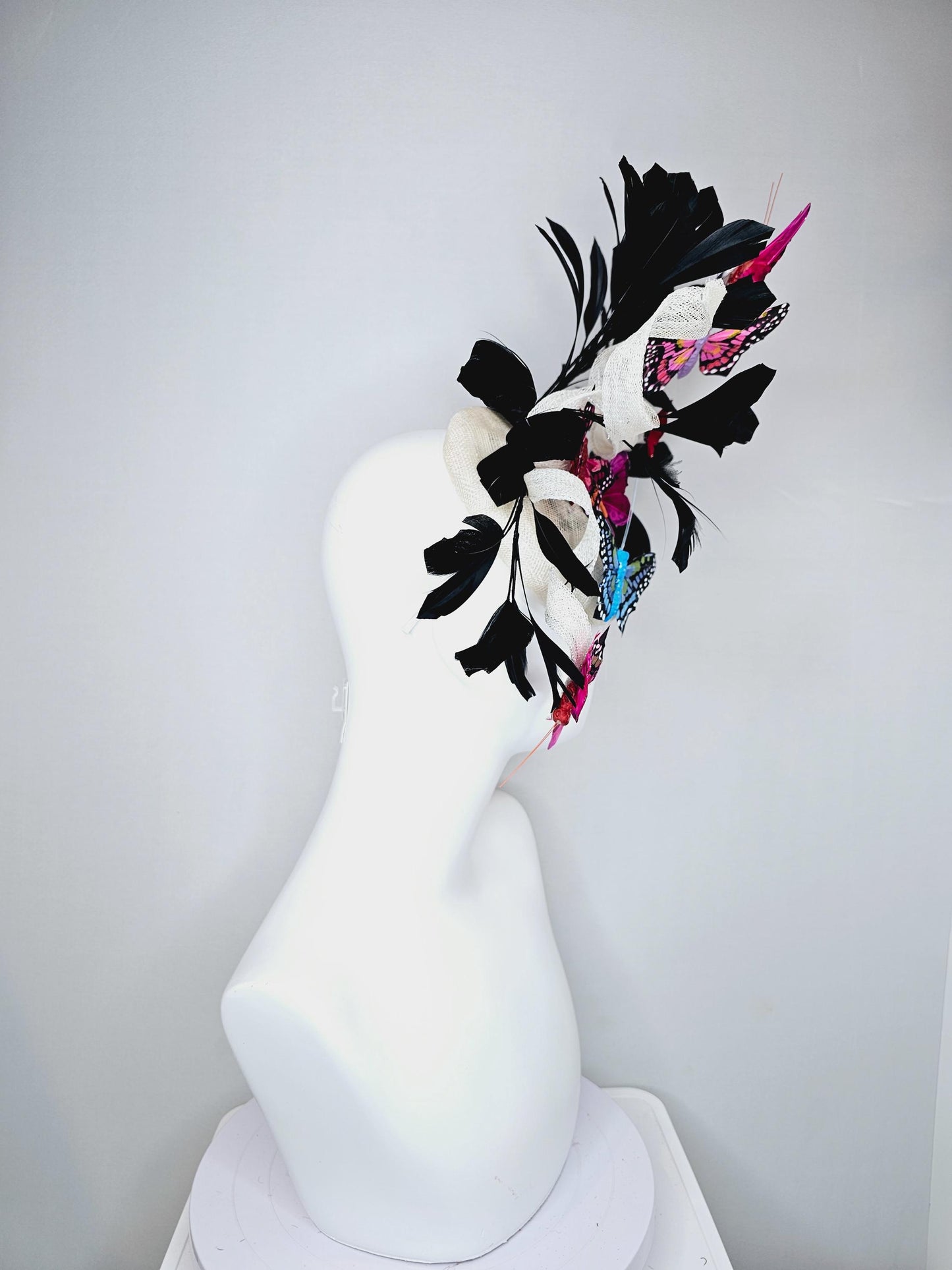 kentucky derby hat fascinator white sinamay with curls,black branching feathers,colorful rainbow pink,blue,purple,red painted butterflies
