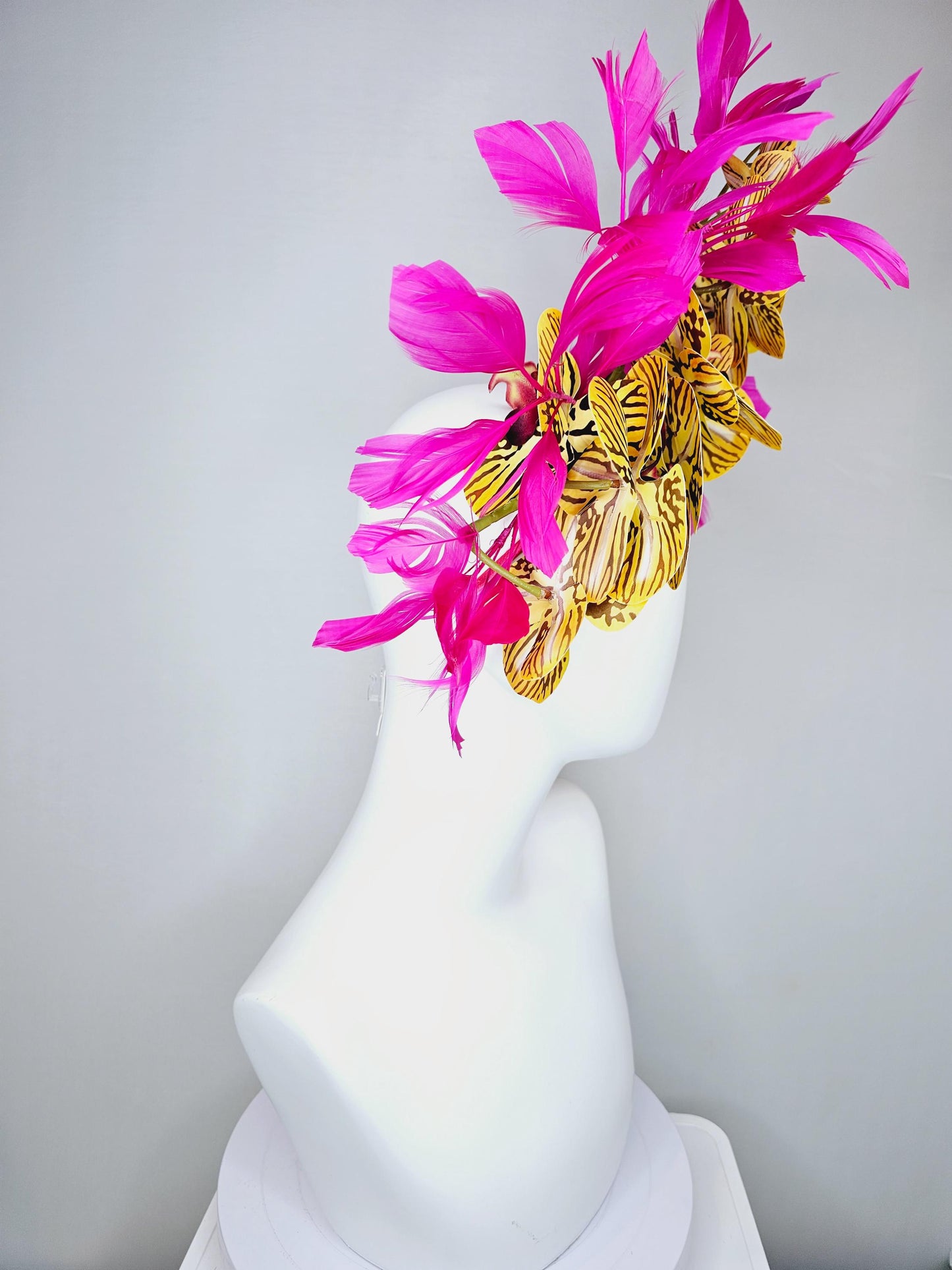 kentucky derby hat fascinator large yellow black and burgundy red satin silk orchid flowers with bright fuchsia pink branching feathers