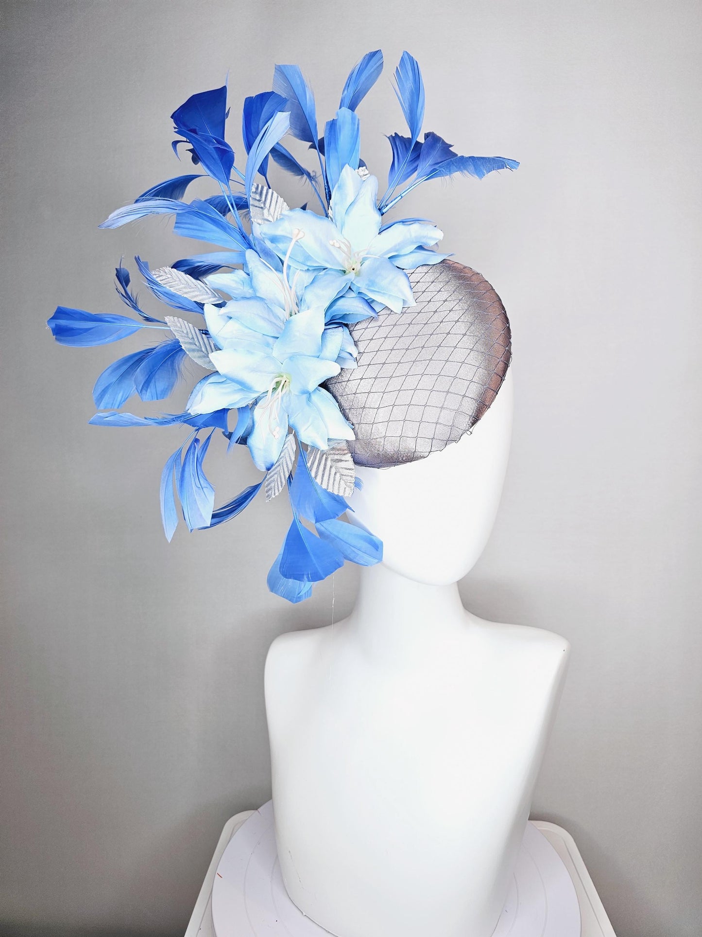 kentucky derby hat fascinator silver gray satin with netting light baby blue satin flowers silver leaves and royal blue branching feathers