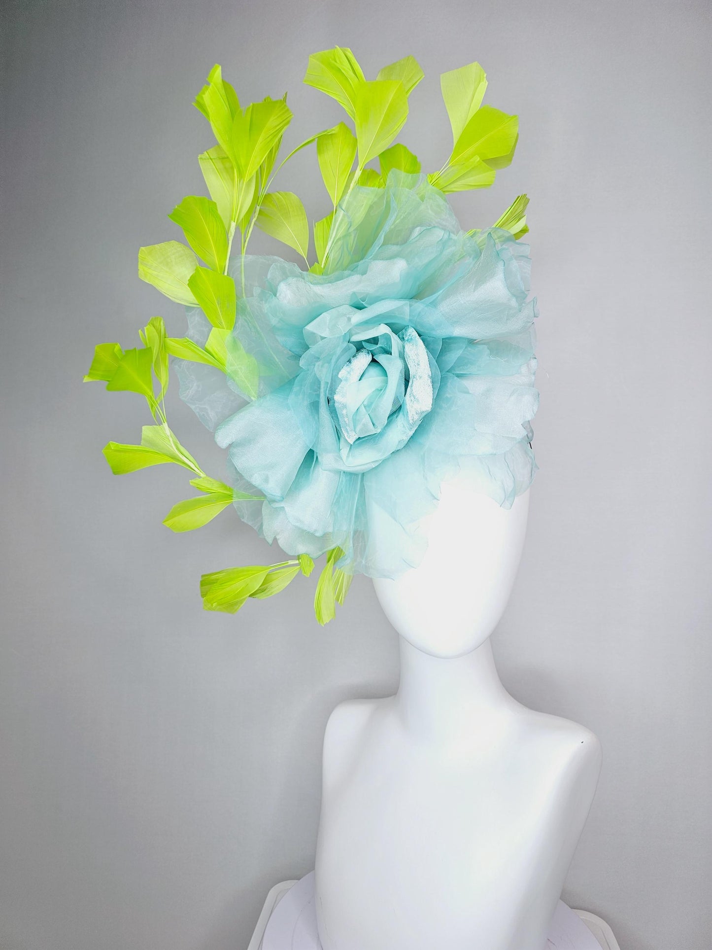 kentucky derby fascinator black headband with very large baby blue organza silk flower and lime green branching feathers
