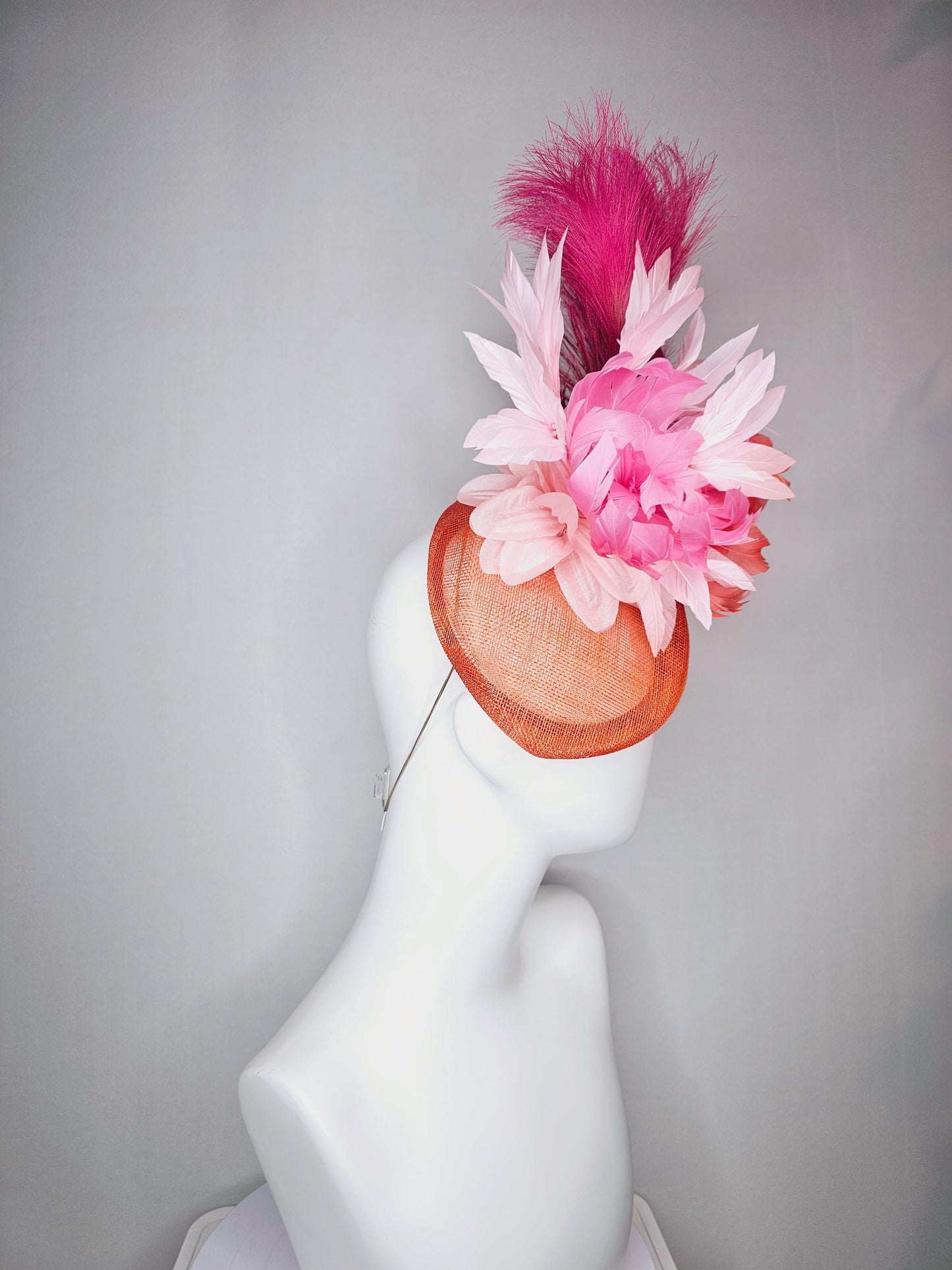 kentucky derby hat fascinator pointed burnt orange sinamay with light pink red orange feather flowers pink feathers hot pink pampas grass