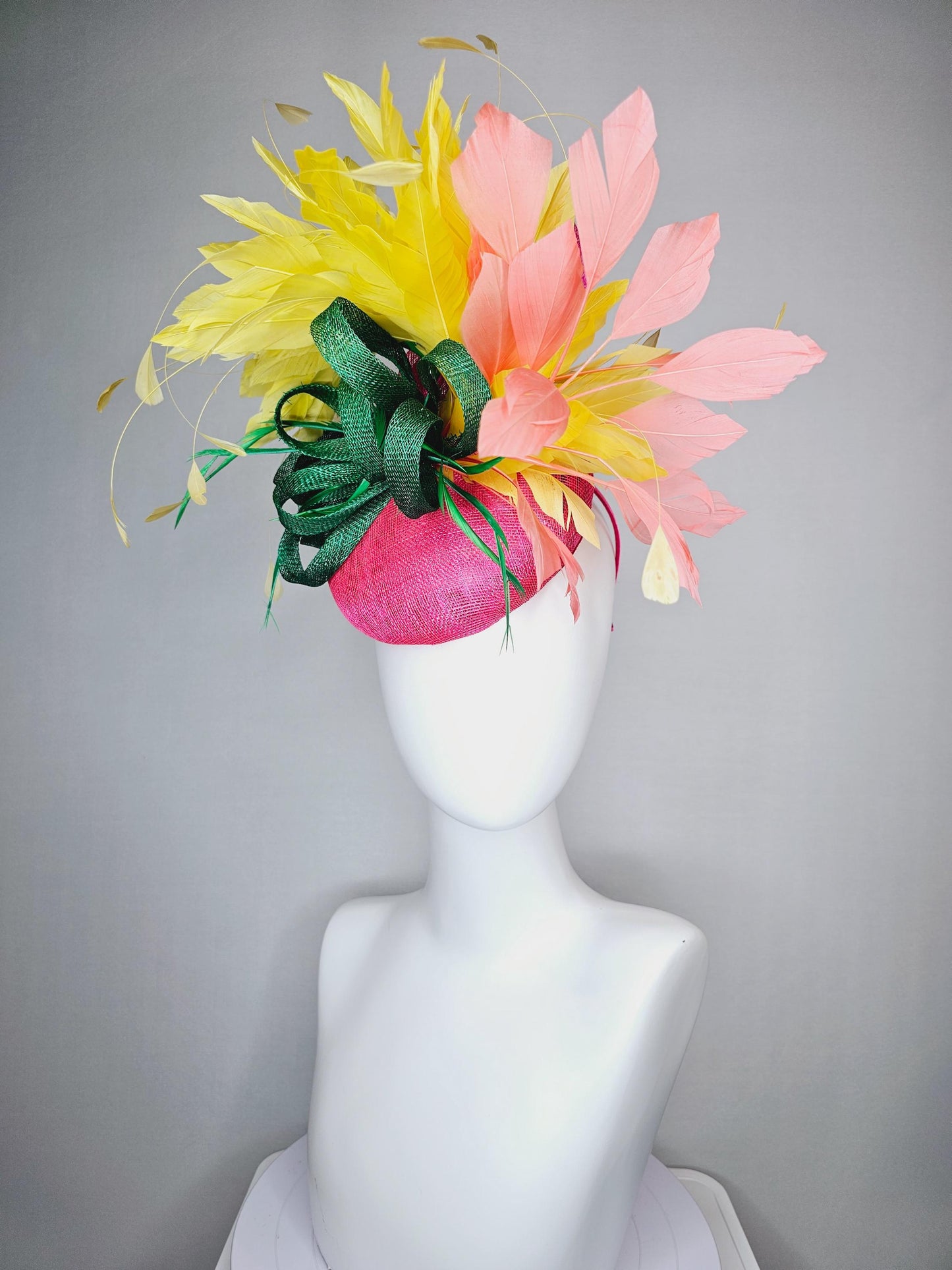 kentucky derby hat fascinator hot pink sinamay with dark green sinamay curls and yellow and peach coral branching feathers