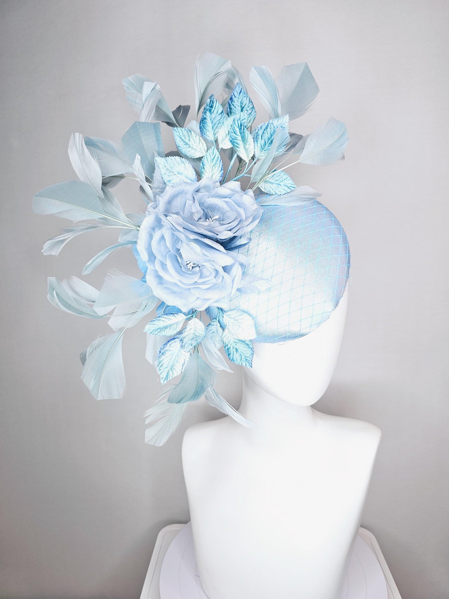 kentucky derby hat fascinator baby blue satin with netting light blue satin rose flowers blue ombre velvet leaves light teal blue feathers