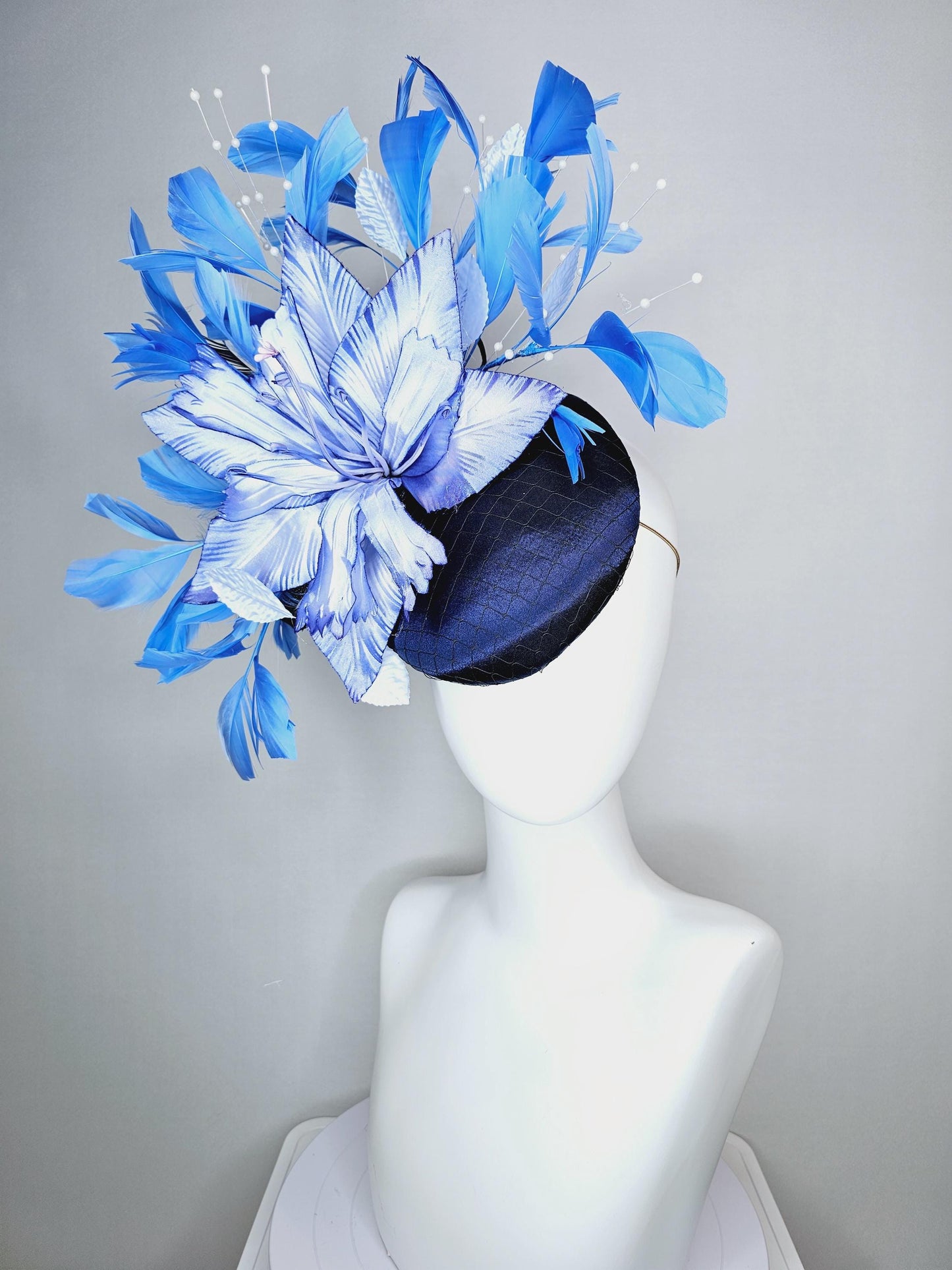 kentucky derby hat fascinator navy blue satin with netting large ombre blue satin flower white leaves navy blue sky blue branching feathers