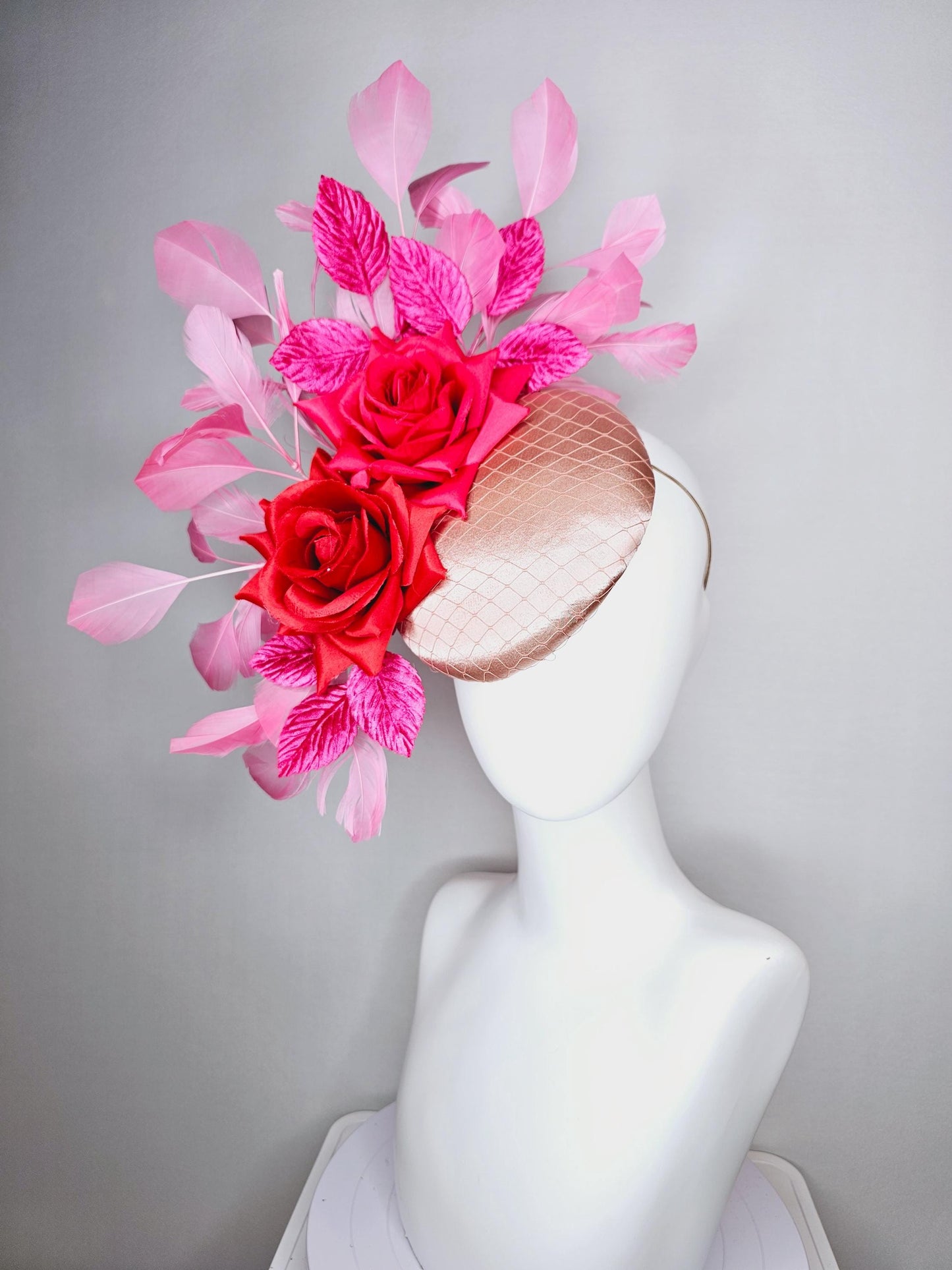 kentucky derby hat fascinator champagne pink satin with netting red satin rose flowers pink leaves and baby blush pink branching feathers