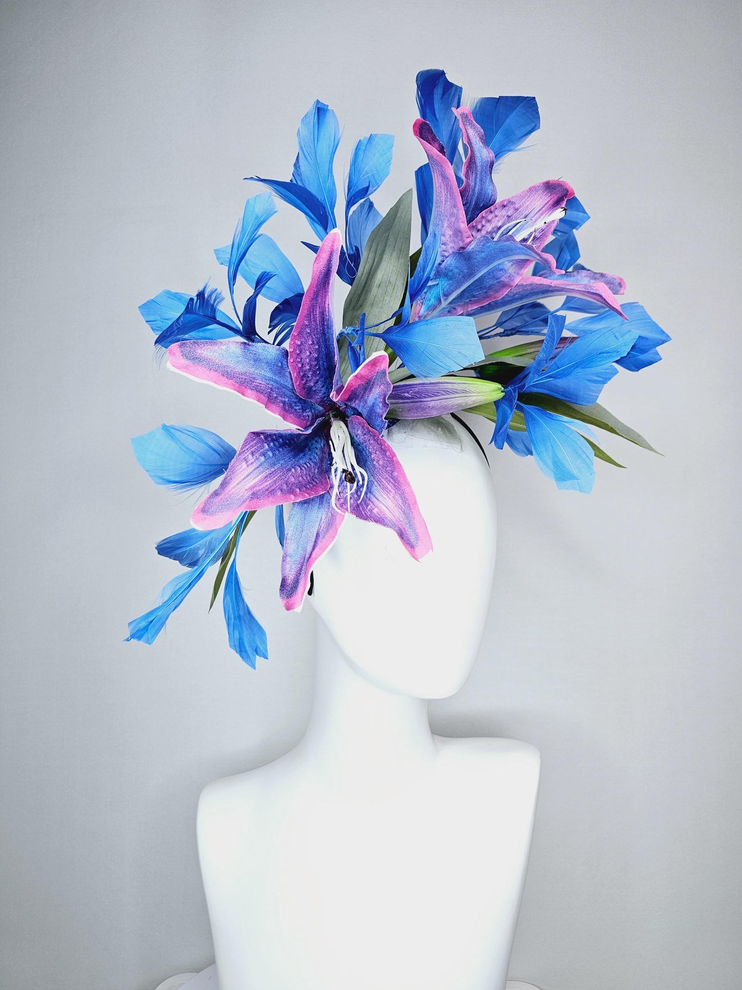 kentucky derby hat fascinator cobalt blue and pink ombre satin silk flowers with pastel green leaves and cobalt blue branching feathers