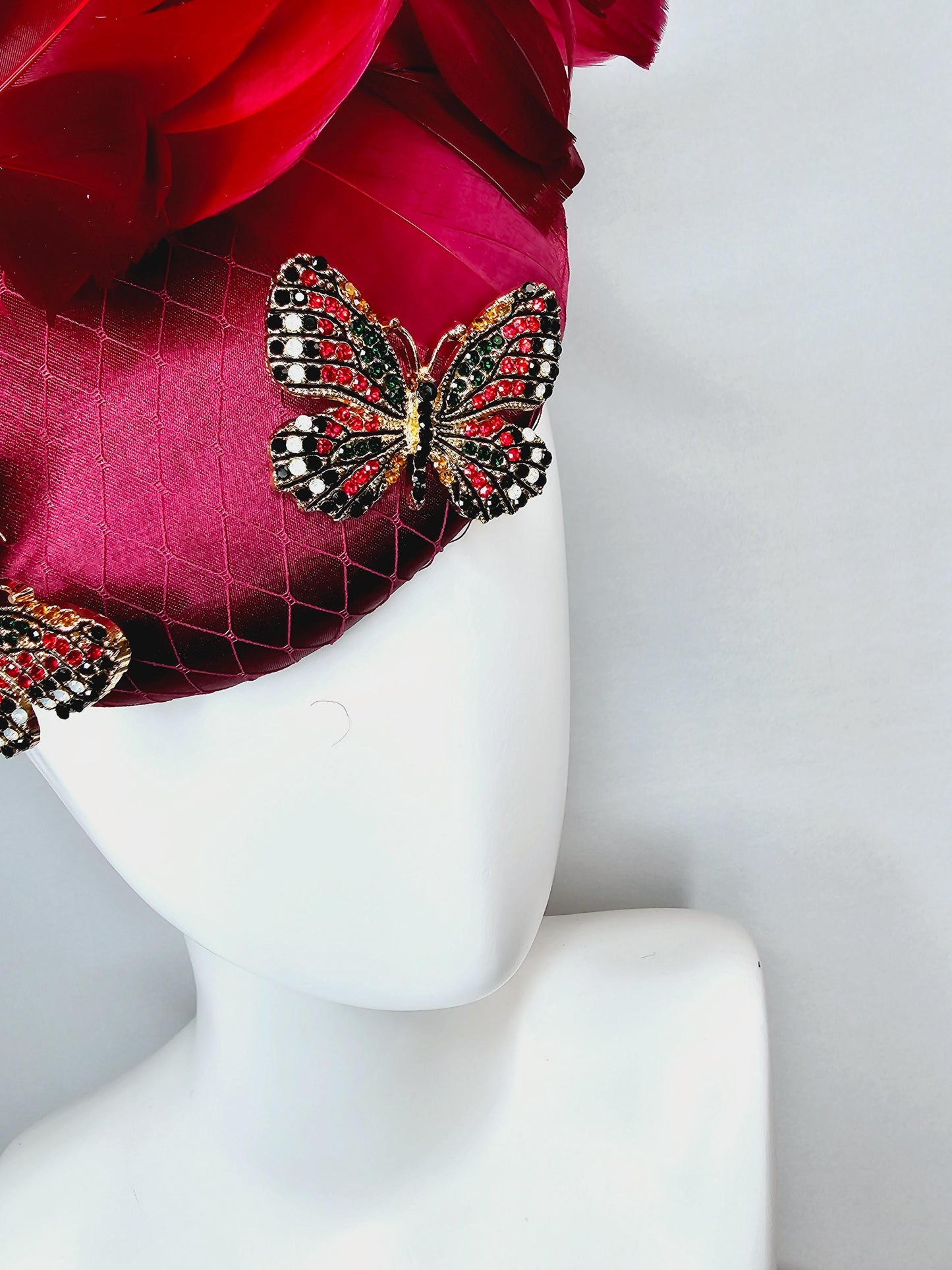 kentucky derby hat fascinator wine red satin with netting and colorful crystal jewels butterflies scarlet red wine red branching feathers