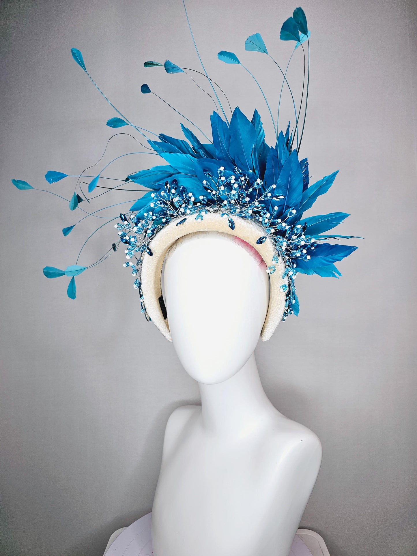 kentucky derby hat fascinator neutral cream velvet headband with blue crystal stems and bright blue branching feathers