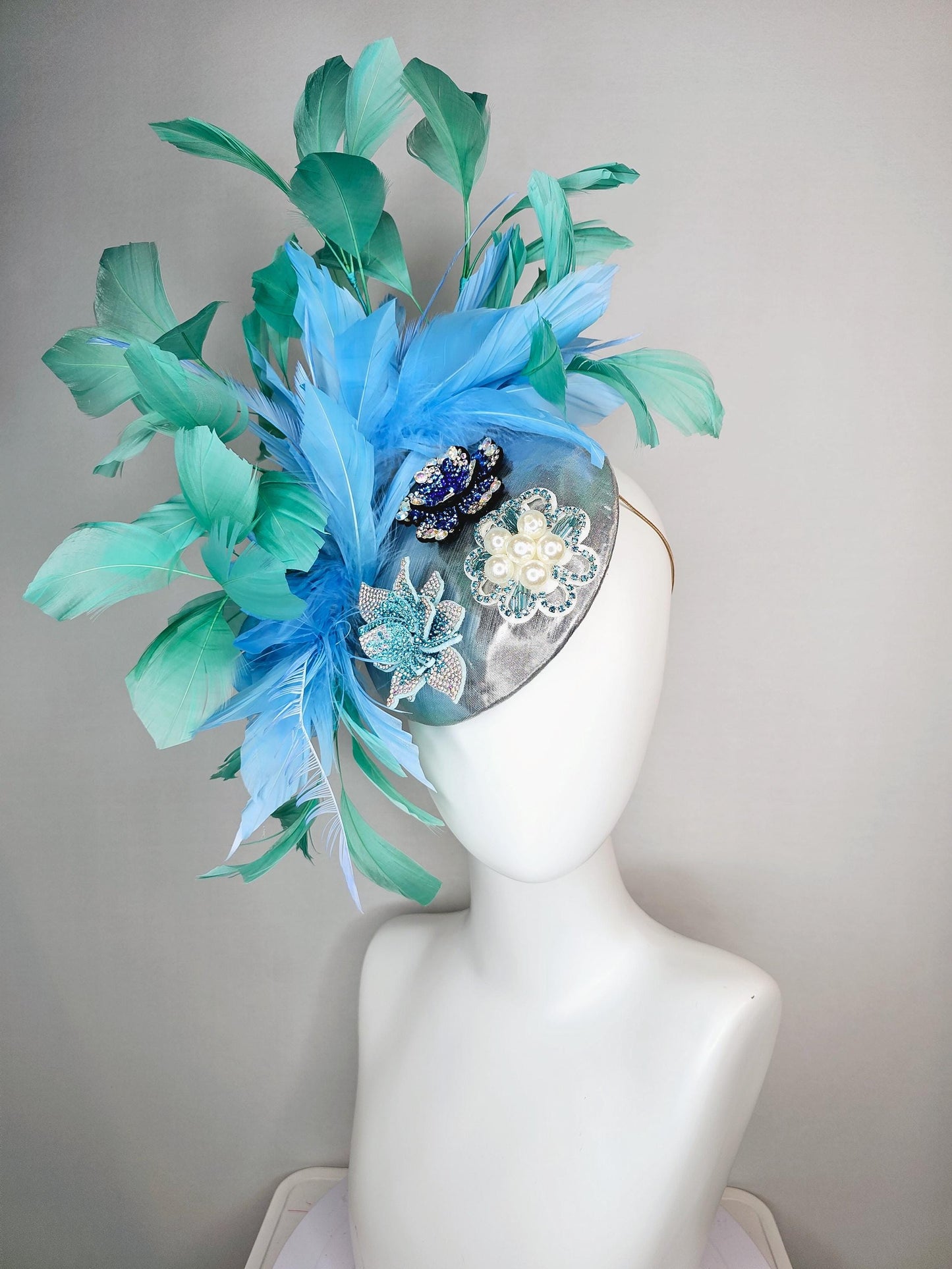 kentucky derby hat fascinator silver metallic with light royal cobalt blue iridescent crystal and pearl flowers mint green sky blue feathers