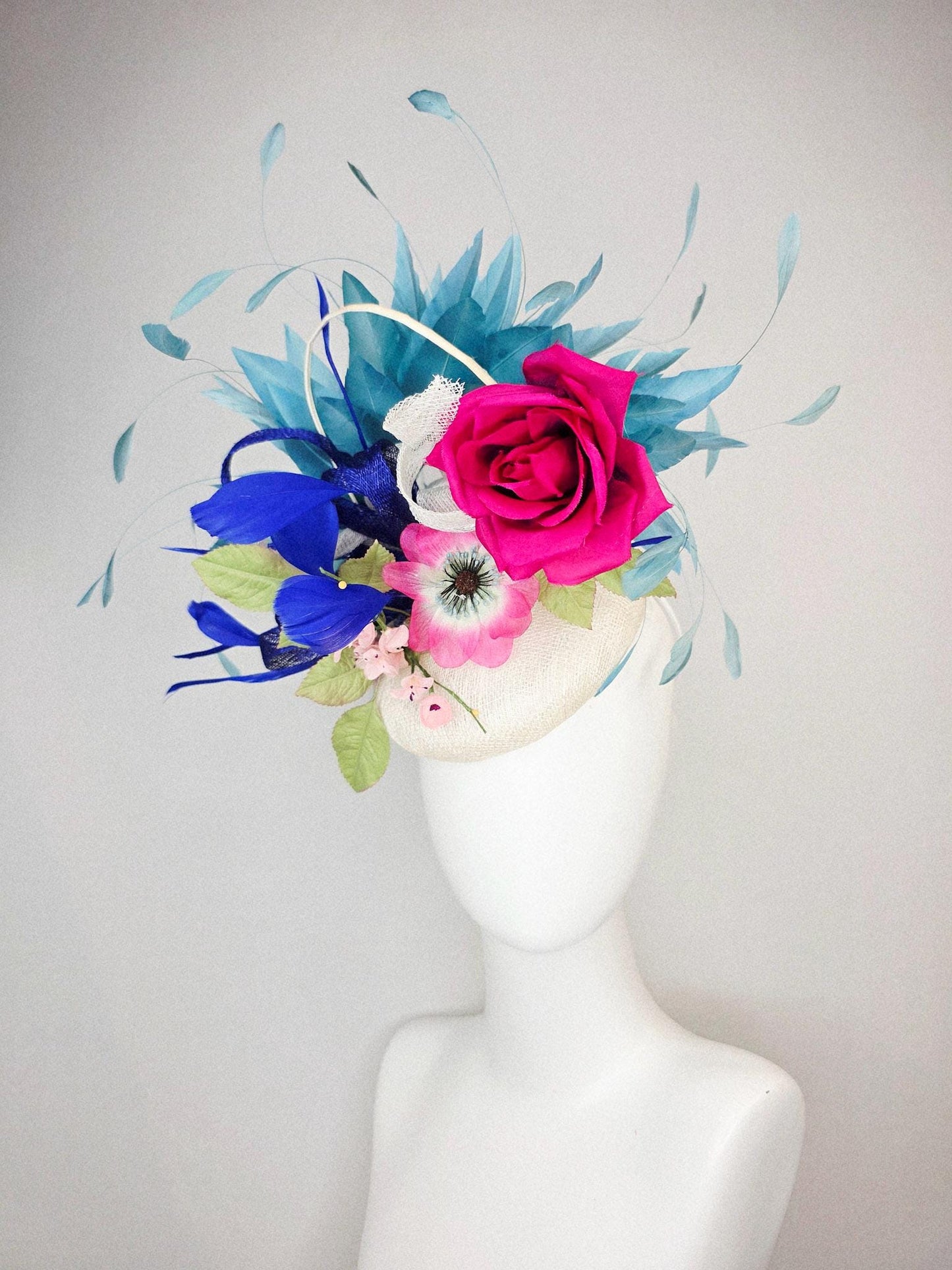 kentucky derby hat fascinator white sinamay with curls fuchsia satin rose and pink flowers light green leaves and cobalt teal blue feathers