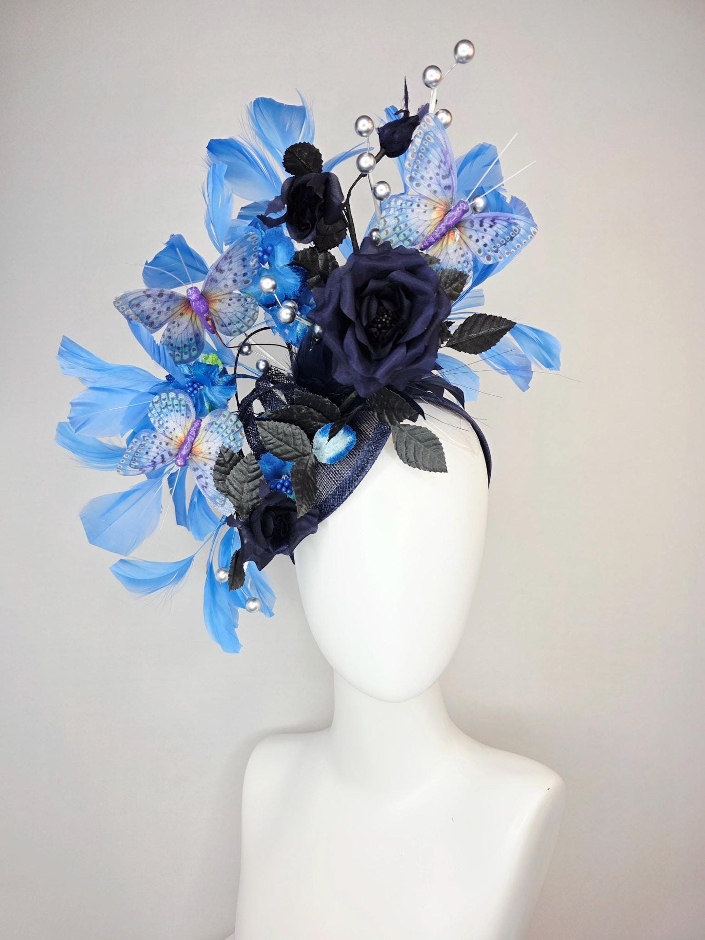 kentucky derby hat fascinator navy blue satin roses black leaves royal blue sky blue feathers silver pearls lavender purple blue butterflies