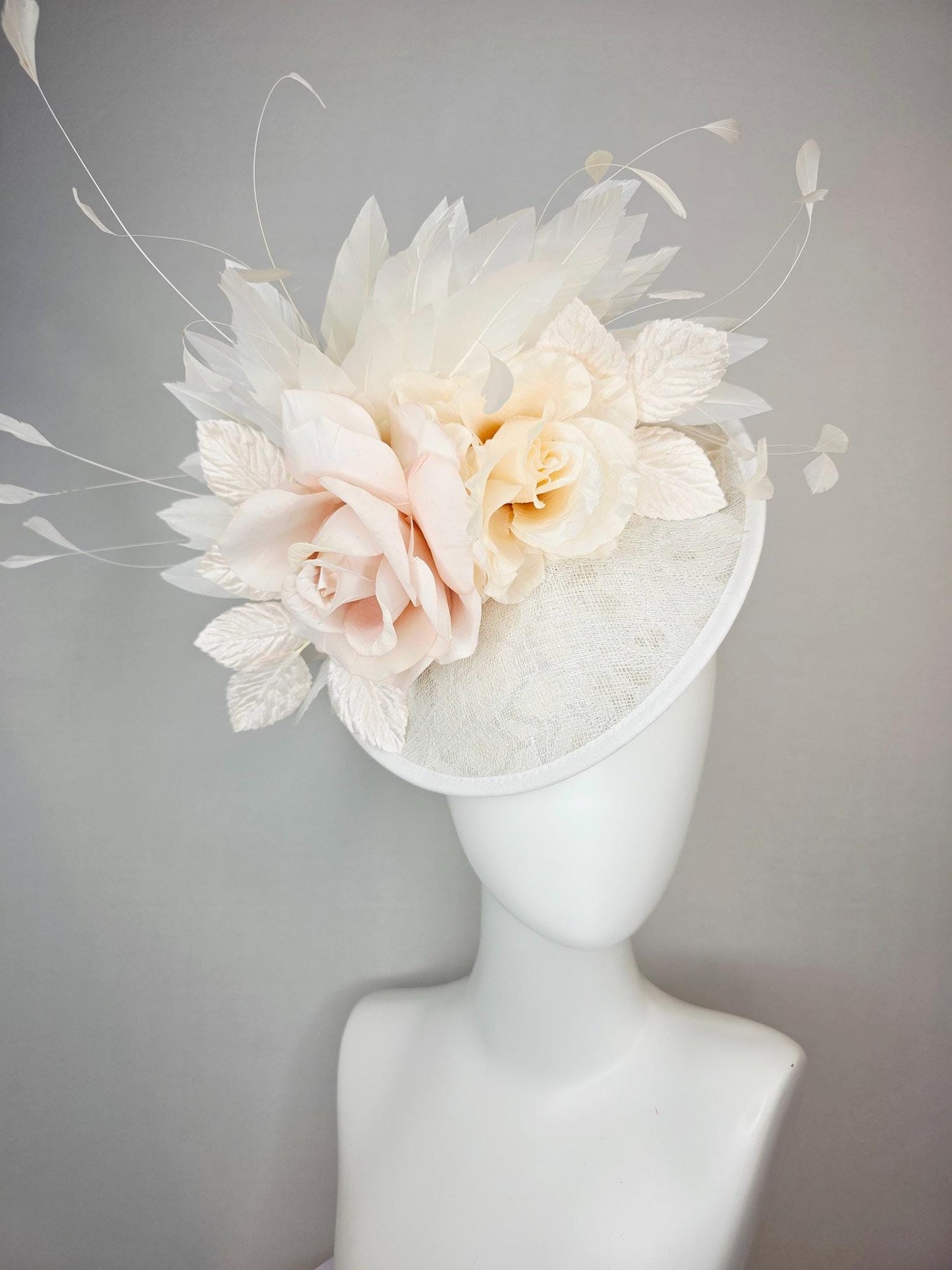 kentucky derby hat fascinator neutral ivory white sinamay saucer with champagne pink and cream organza roses with leaves and white feathers