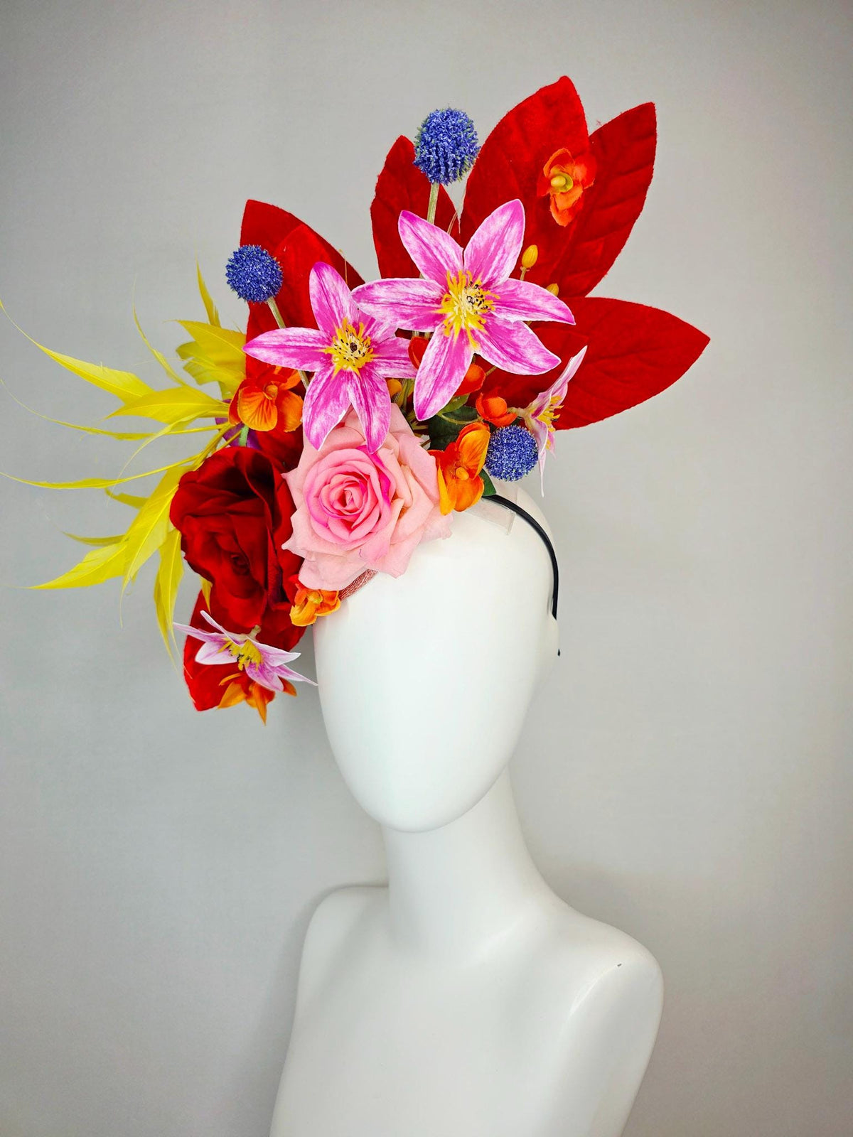 kentucky derby hat fascinator red light pink satin roses orange red pink magenta purple flowers blue thistle red leaves and yellow feathers