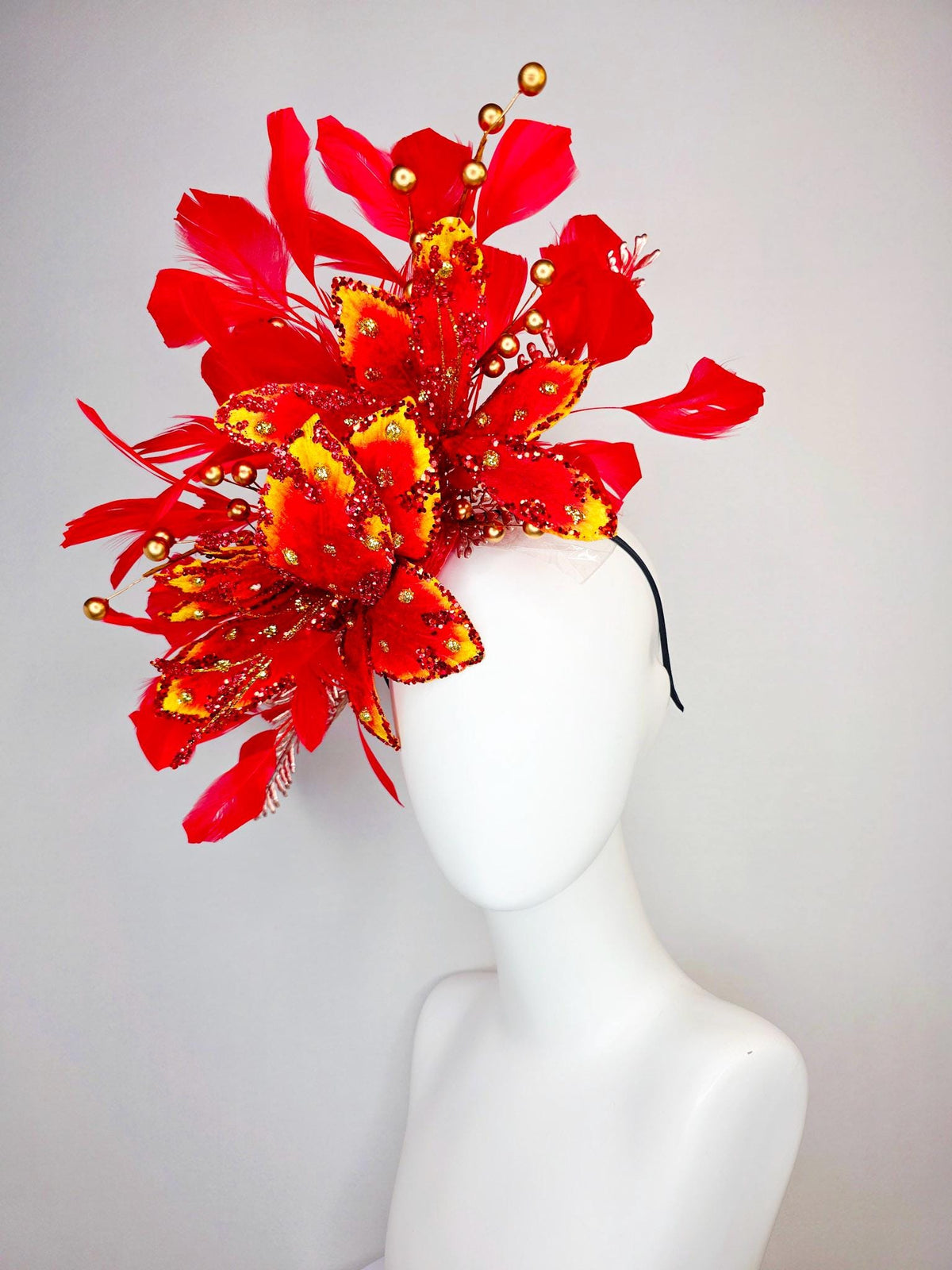 kentucky derby hat fascinator scarlet red and yellow with red sequin satin flowers bright red branching feathers and gold pearl stems
