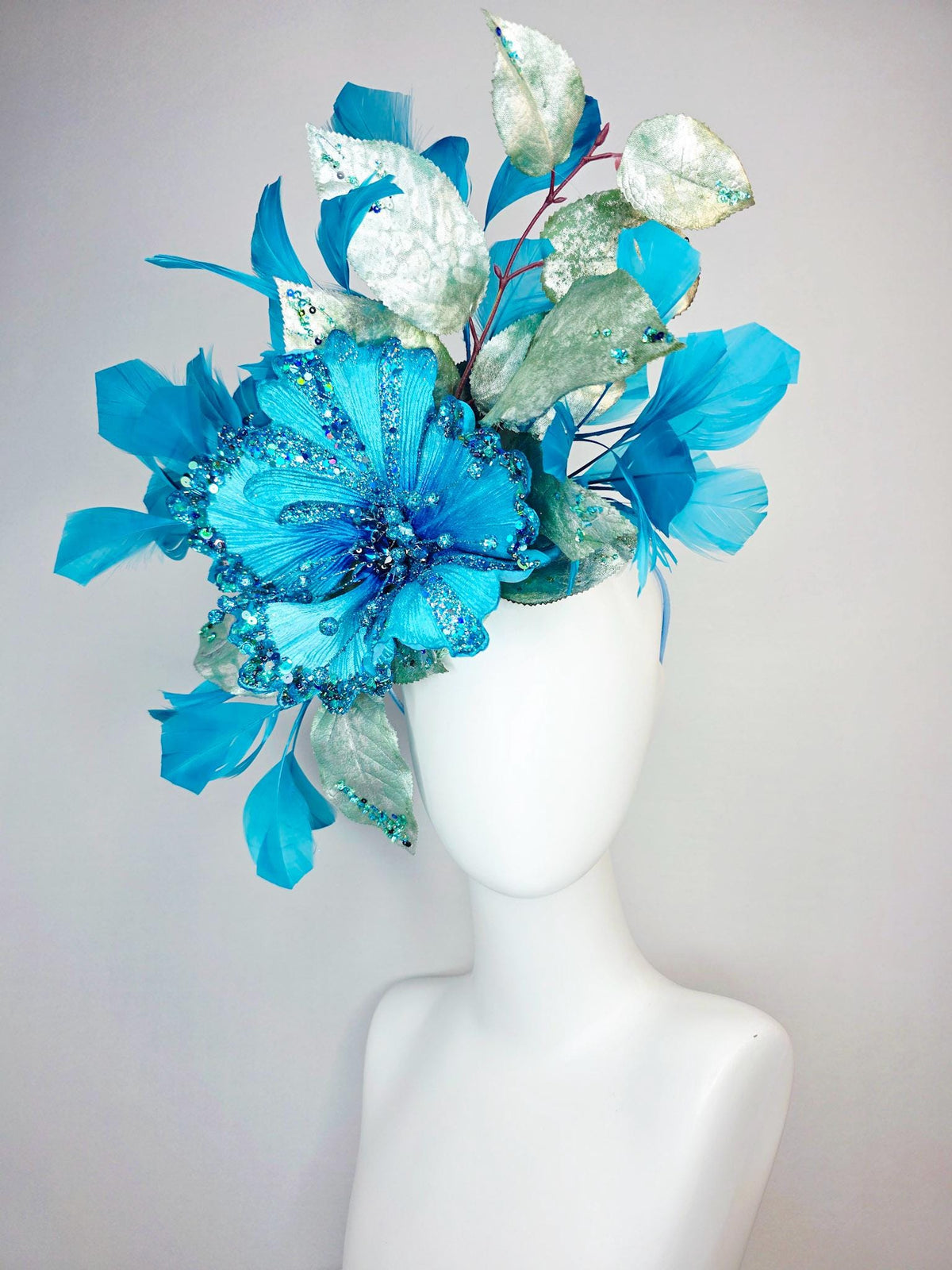 kentucky derby hat fascinator large with sky ocean blue satin flower with sequin silver sage green leaves turquoise blue branching feathers