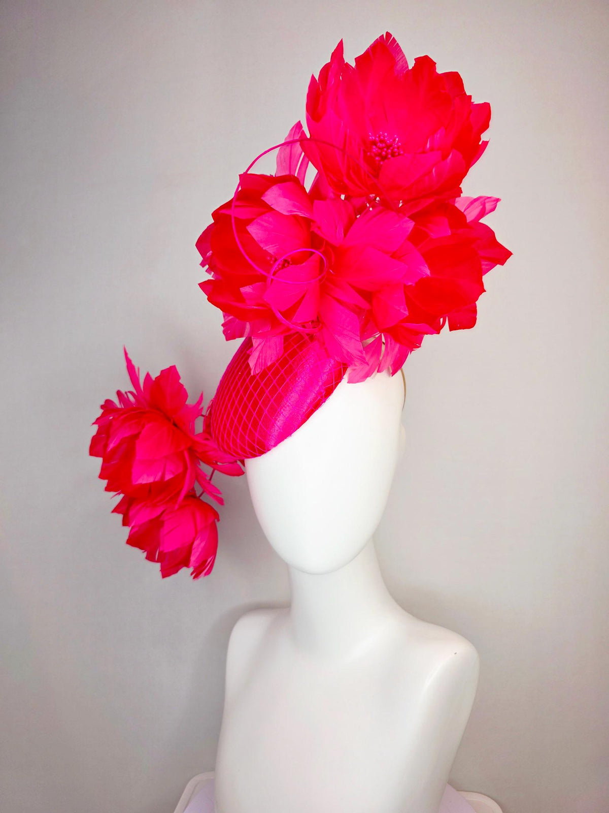 kentucky derby hat fascinator hot raspberry pink satin with netting and large fluffy red feather flowers with fuchsia pink feathers