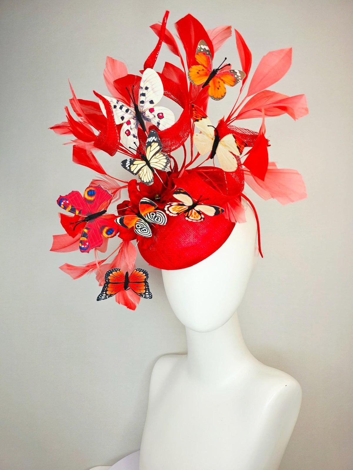 kentucky derby hat fascinator scarlet red sinamay with curls red organza flower coral red feathers white cream orange blue black butterflies