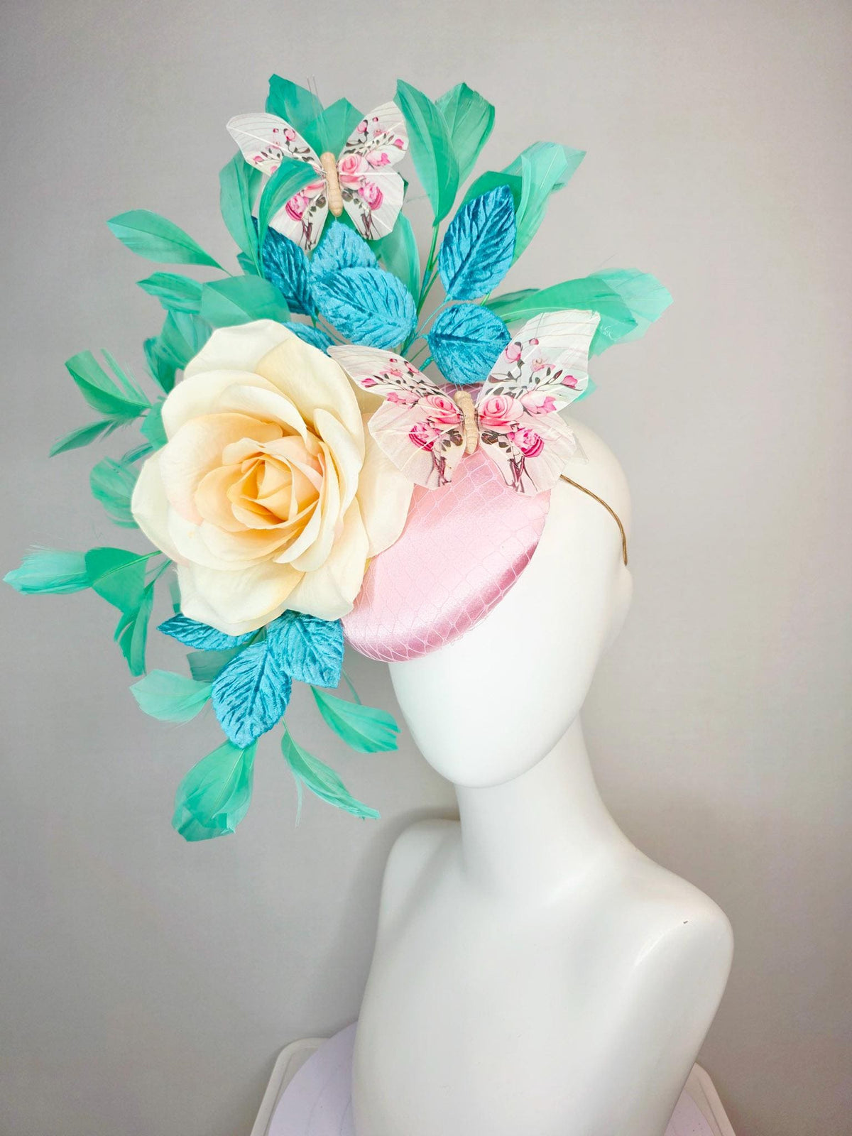 kentucky derby hat fascinator light pink satin with netting ivory cream satin rose turquoise blue leaves mint green feathers and butterflies