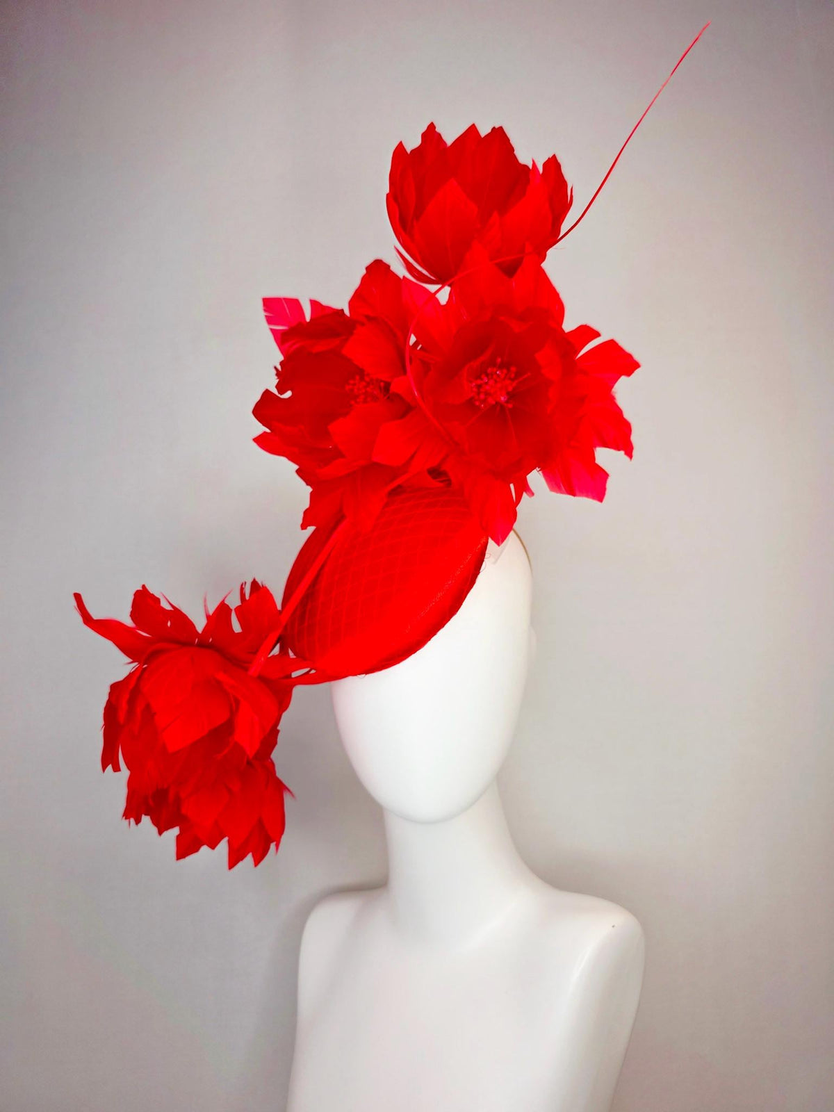 kentucky derby hat fascinator bright red satin with netting and large fluffy bright scarlet red feather flowers and red feathers