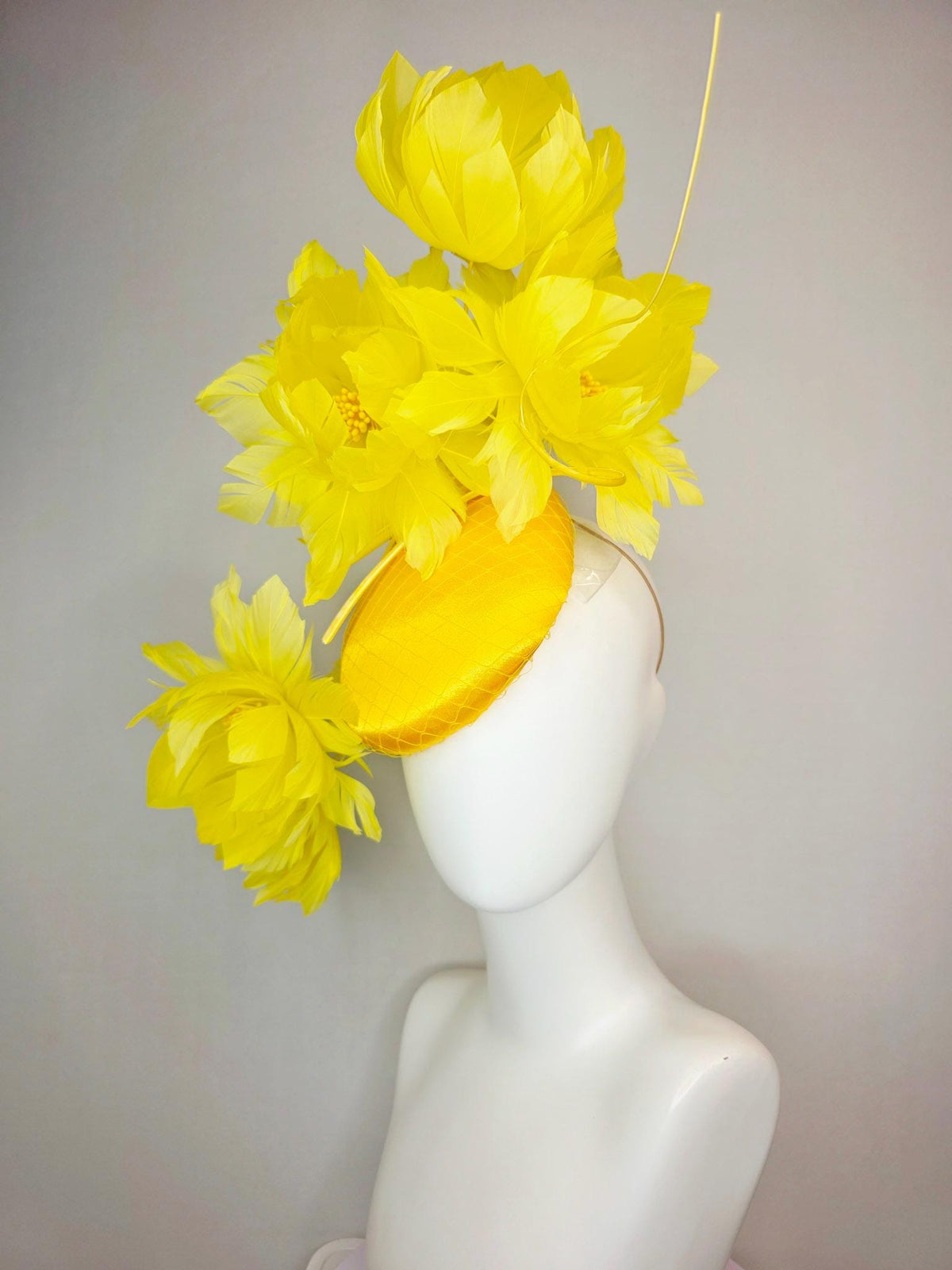 kentucky derby hat fascinator gold yellow satin with netting and large fluffy yellow feather flowers and yellow feathers