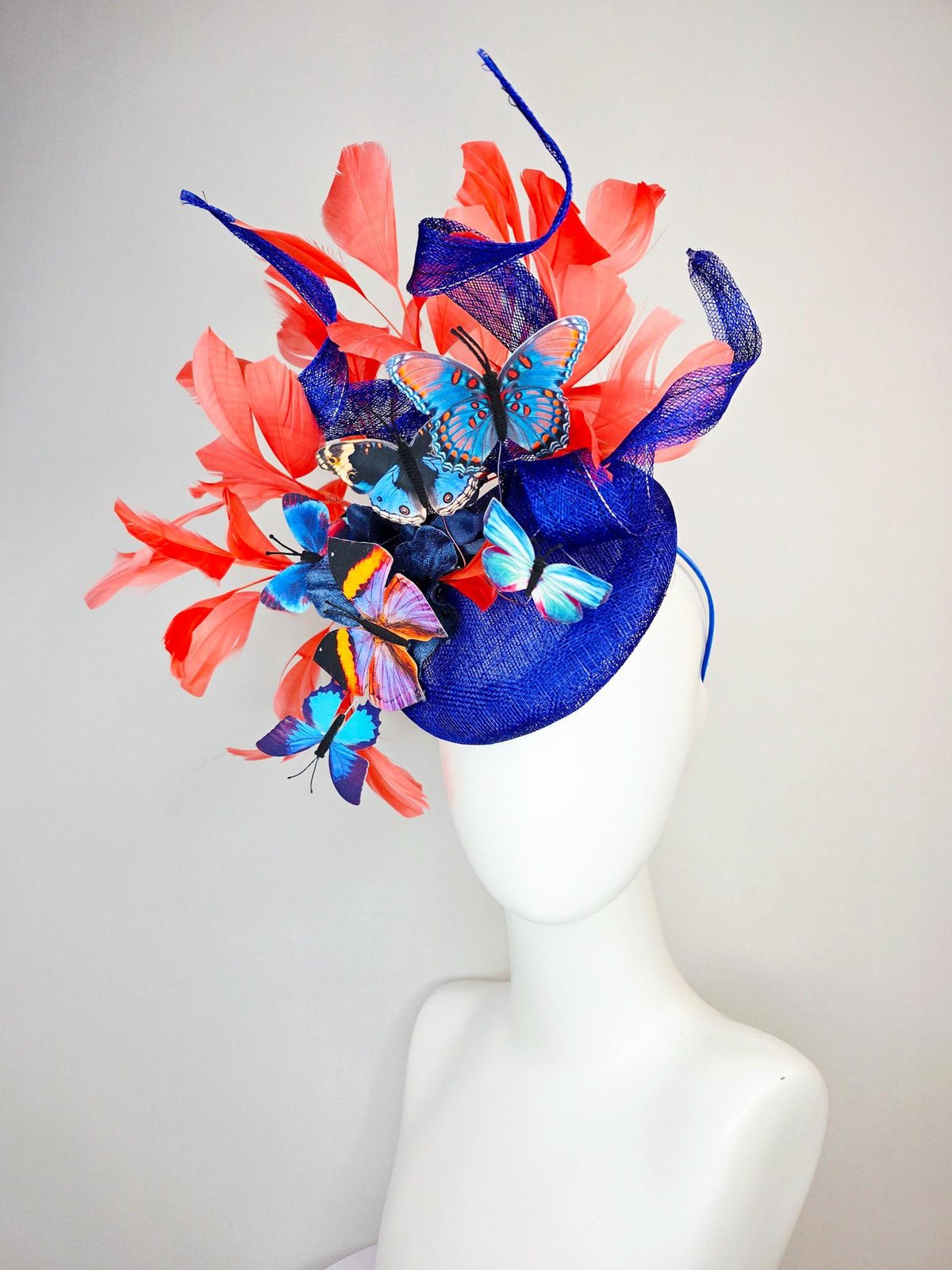 kentucky derby hat fascinator cobalt blue sinamay with curls royal blue organza flower coral orange feathers blue yellow black butterflies