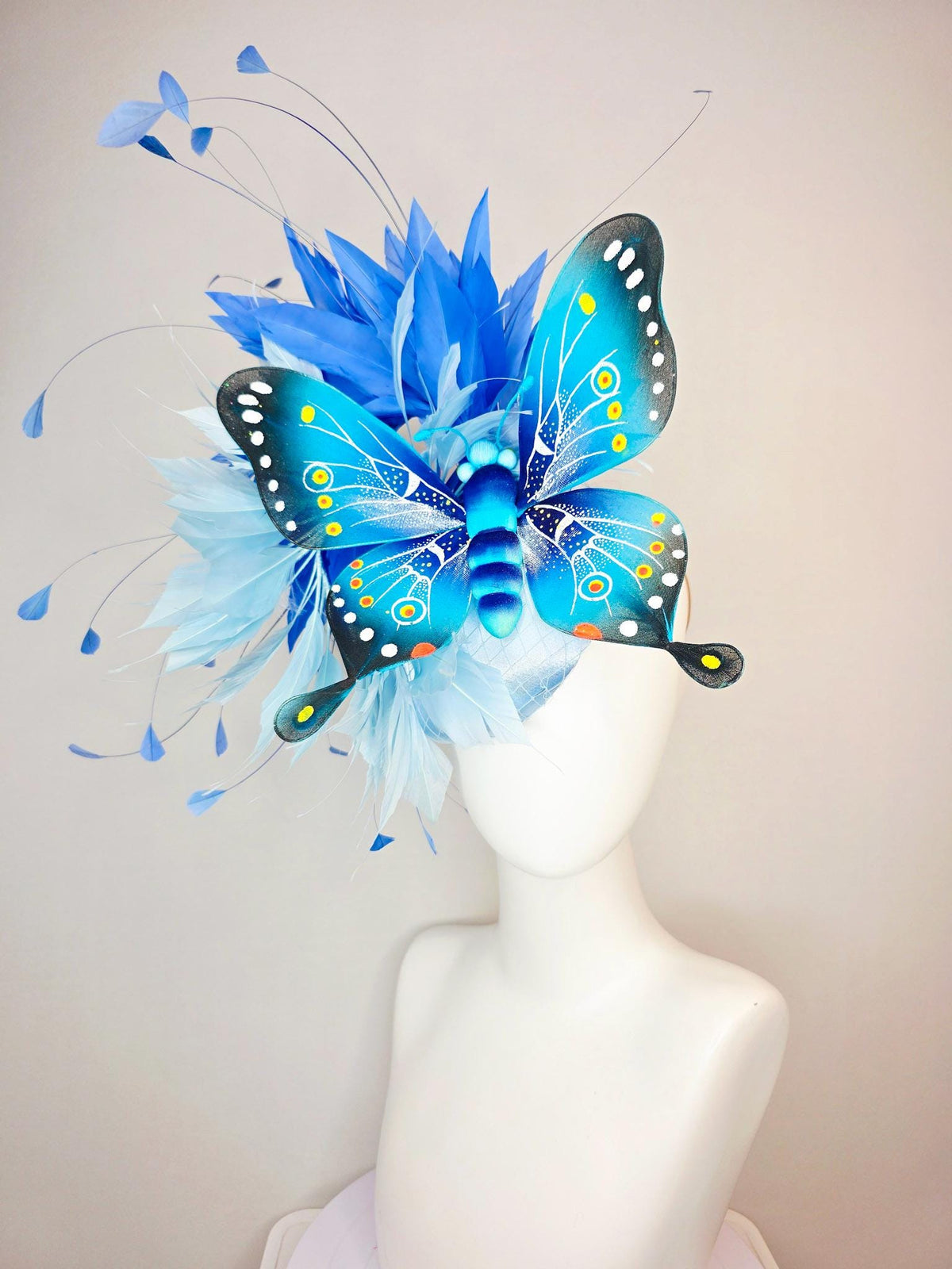 kentucky derby hat fascinator baby blue satin with netting light blue cobalt blue branching feathers large turquoise blue black butterfly