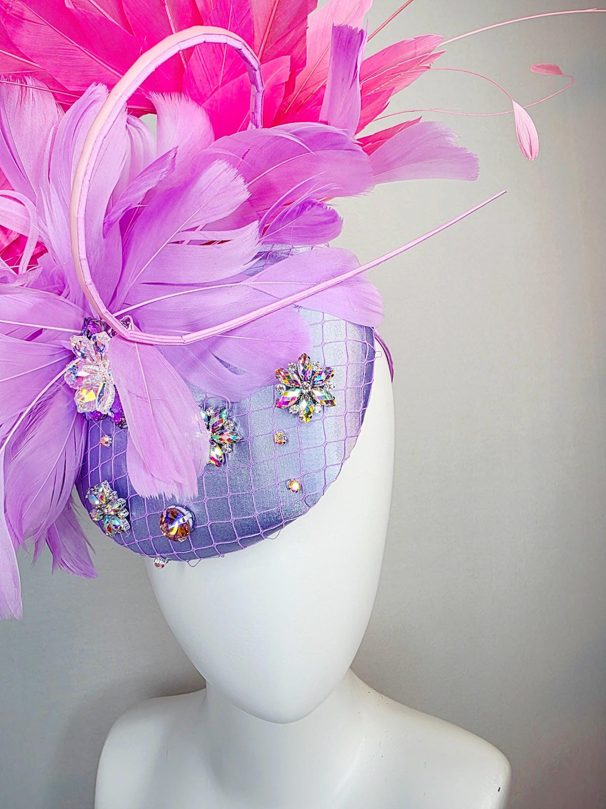 kentucky derby hat fascinator lavender purple satin with netting iridescent crystal rhinestone jewels lilac purple and pink fluffy feathers