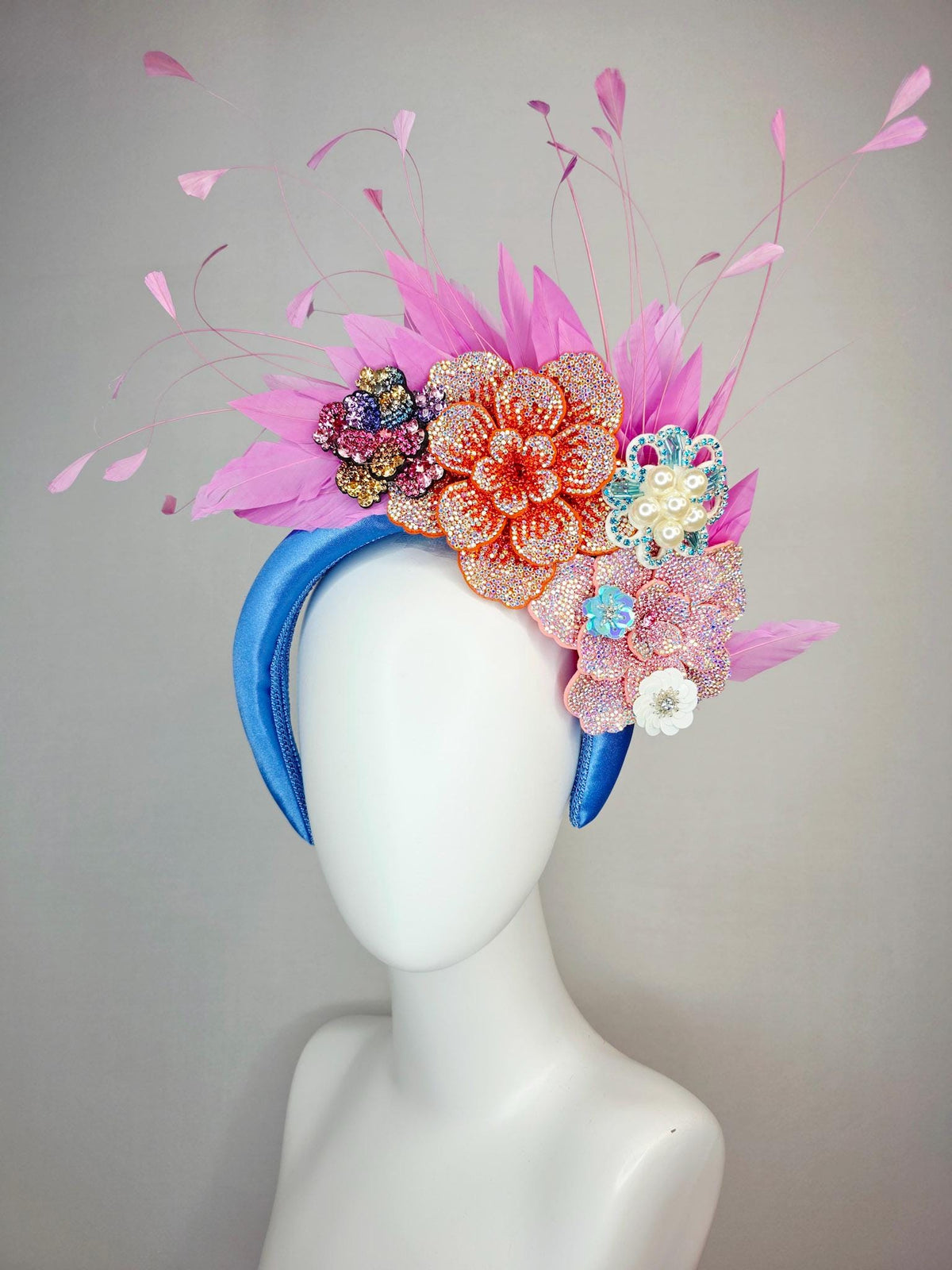 kentucky derby hat fascinator sky blue satin headband with iridescent pink orange blue gold pearl crystal flowers and blush pink feathers